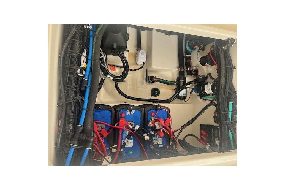 2017 Boston Whaler 280 Outrage engine compartment with wiring and battery setup.