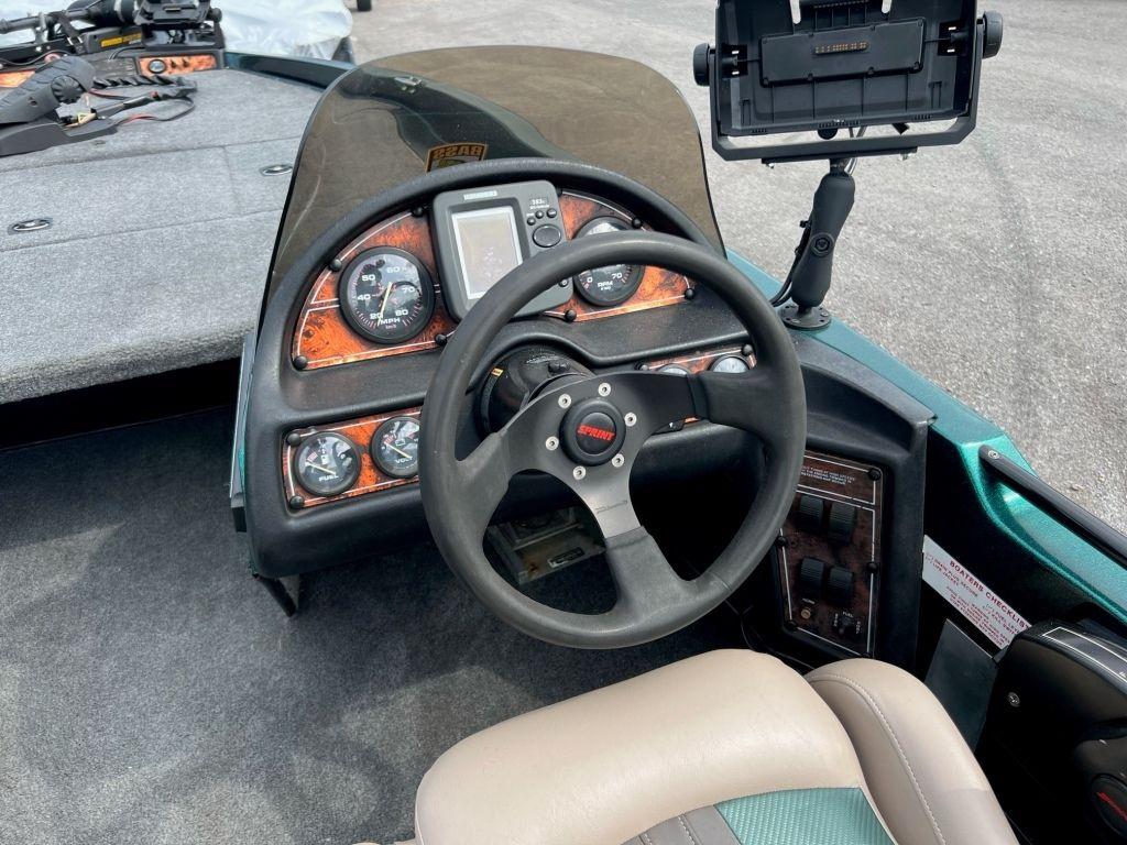 1999 Sprint 286 Pro boat dashboard with steering wheel and instrument panel.
