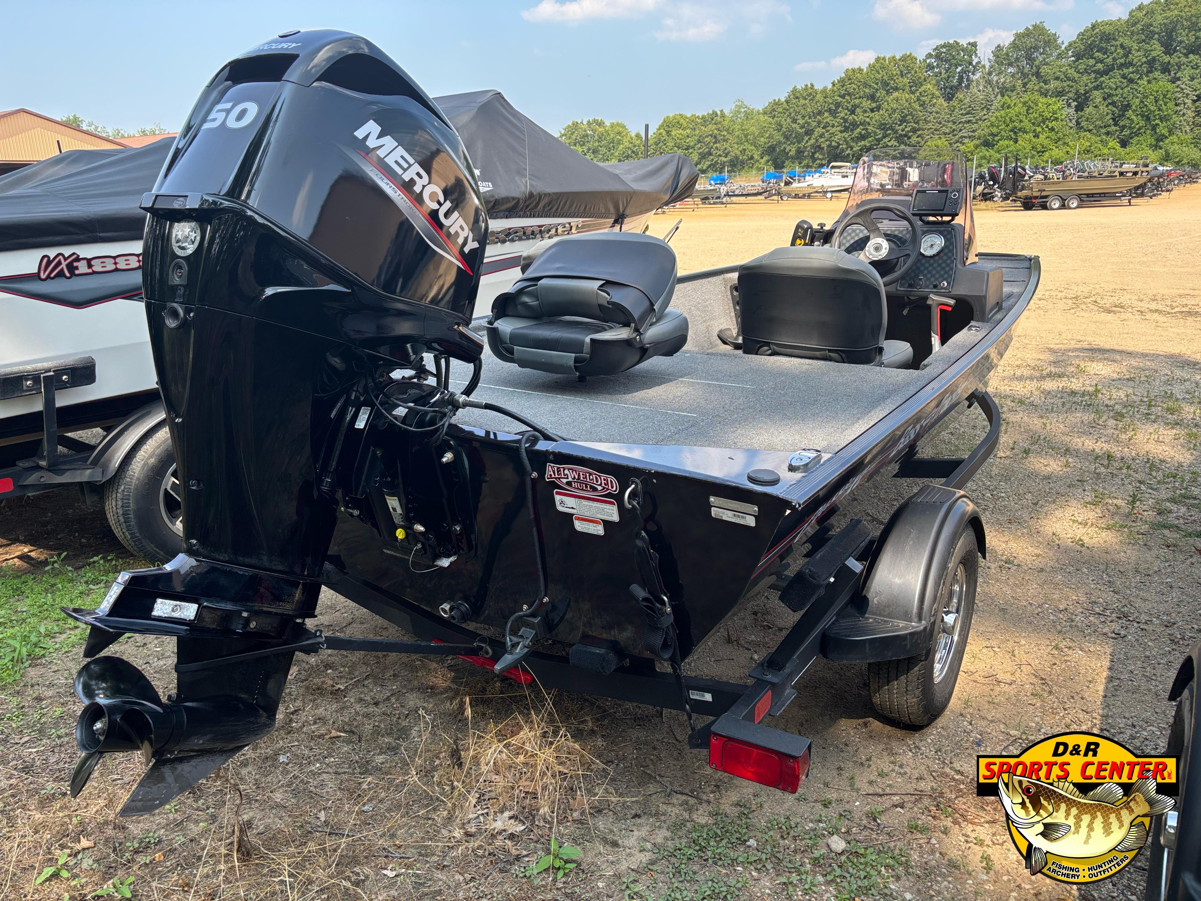 2021 Tracker Bass Tracker Classic XL boat with Mercury engine, parked outdoors.
