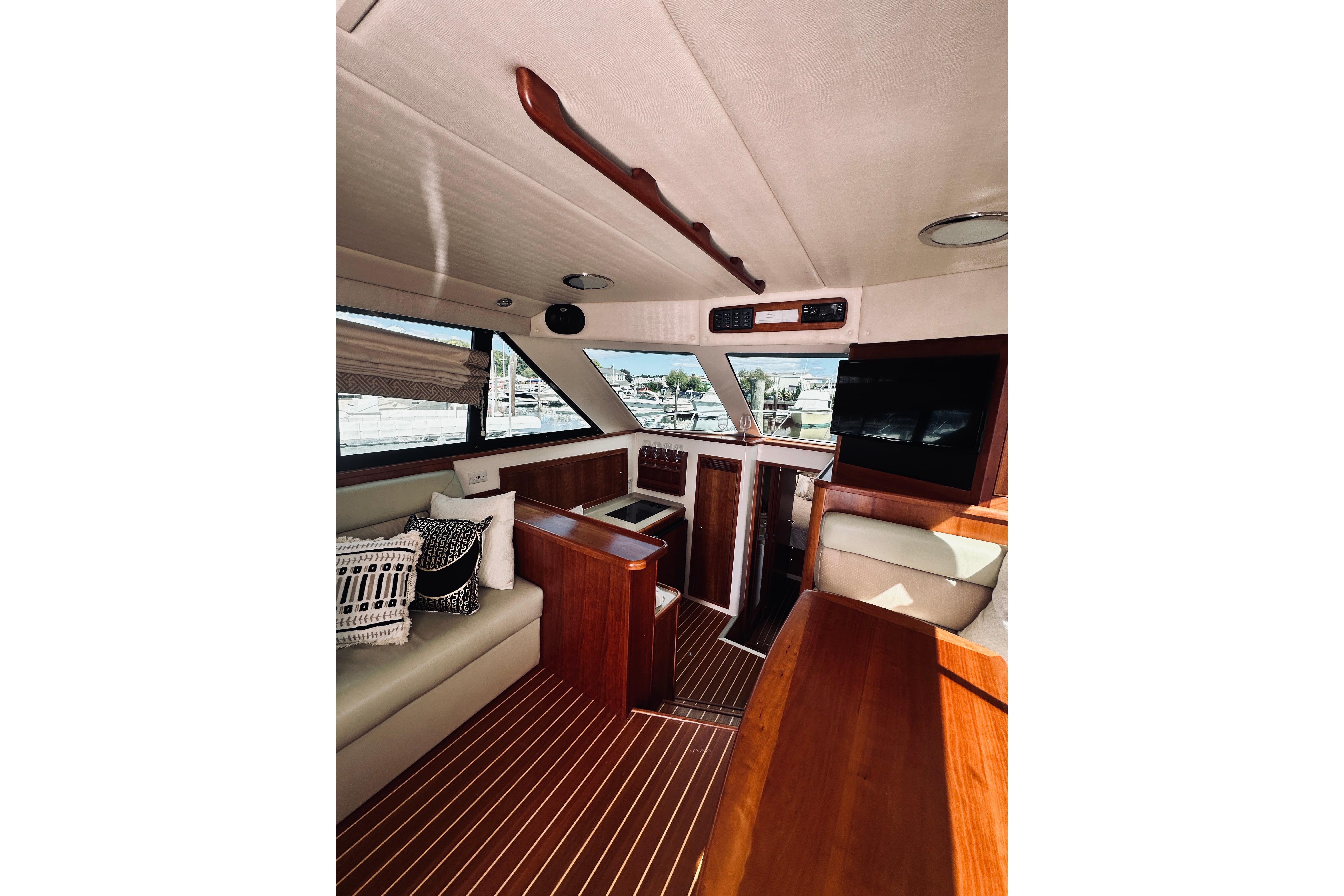 Interior of 2000 Riviera 40 yacht with elegant wood finish and modern amenities.
