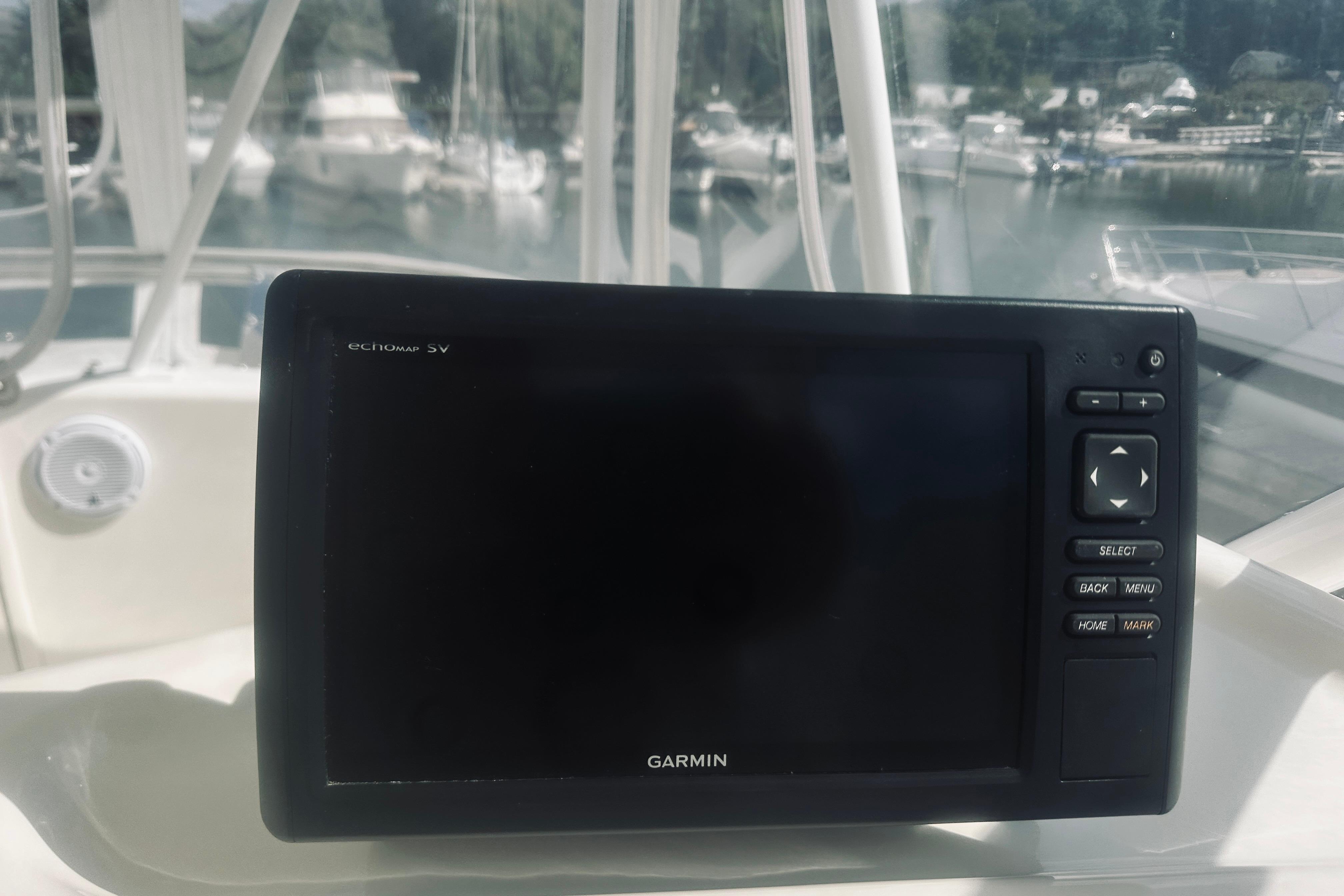 Garmin echomap 5V on 2000 Riviera 40 yacht, docked with boats in background.