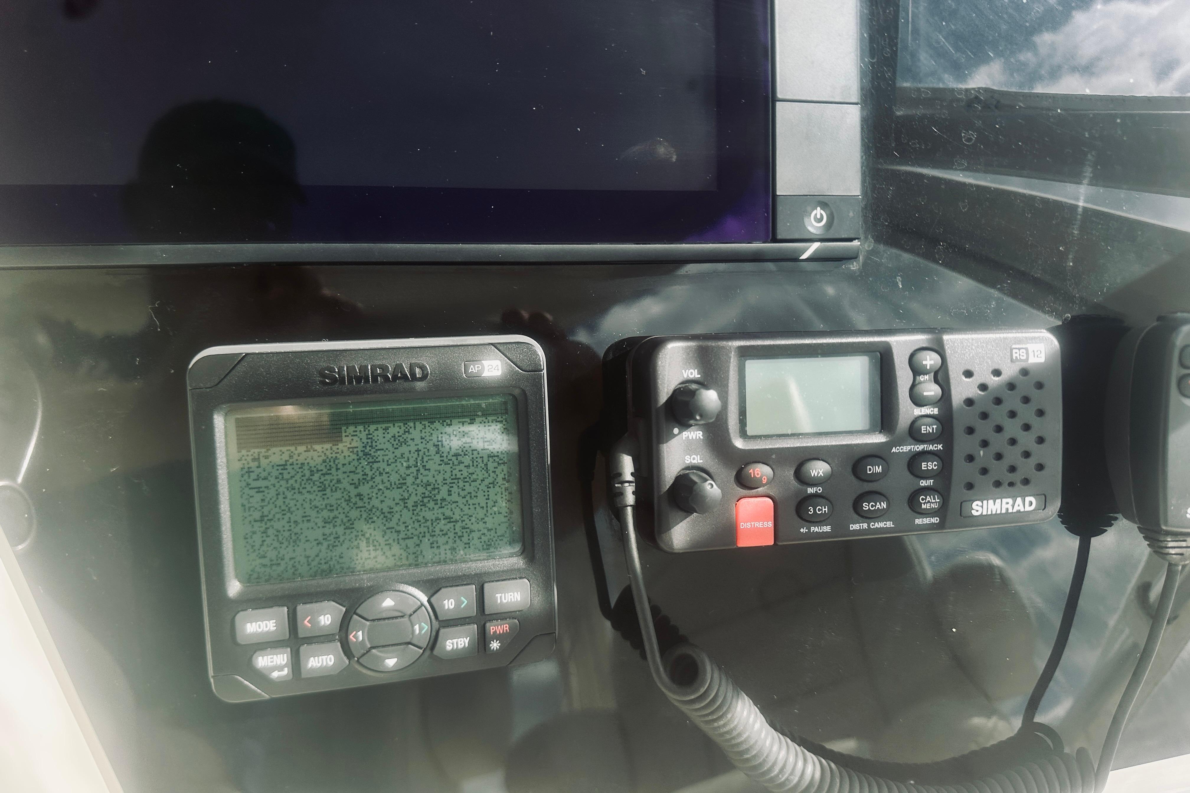 Simrad marine electronics on a 2000 Riviera 40 yacht dashboard.