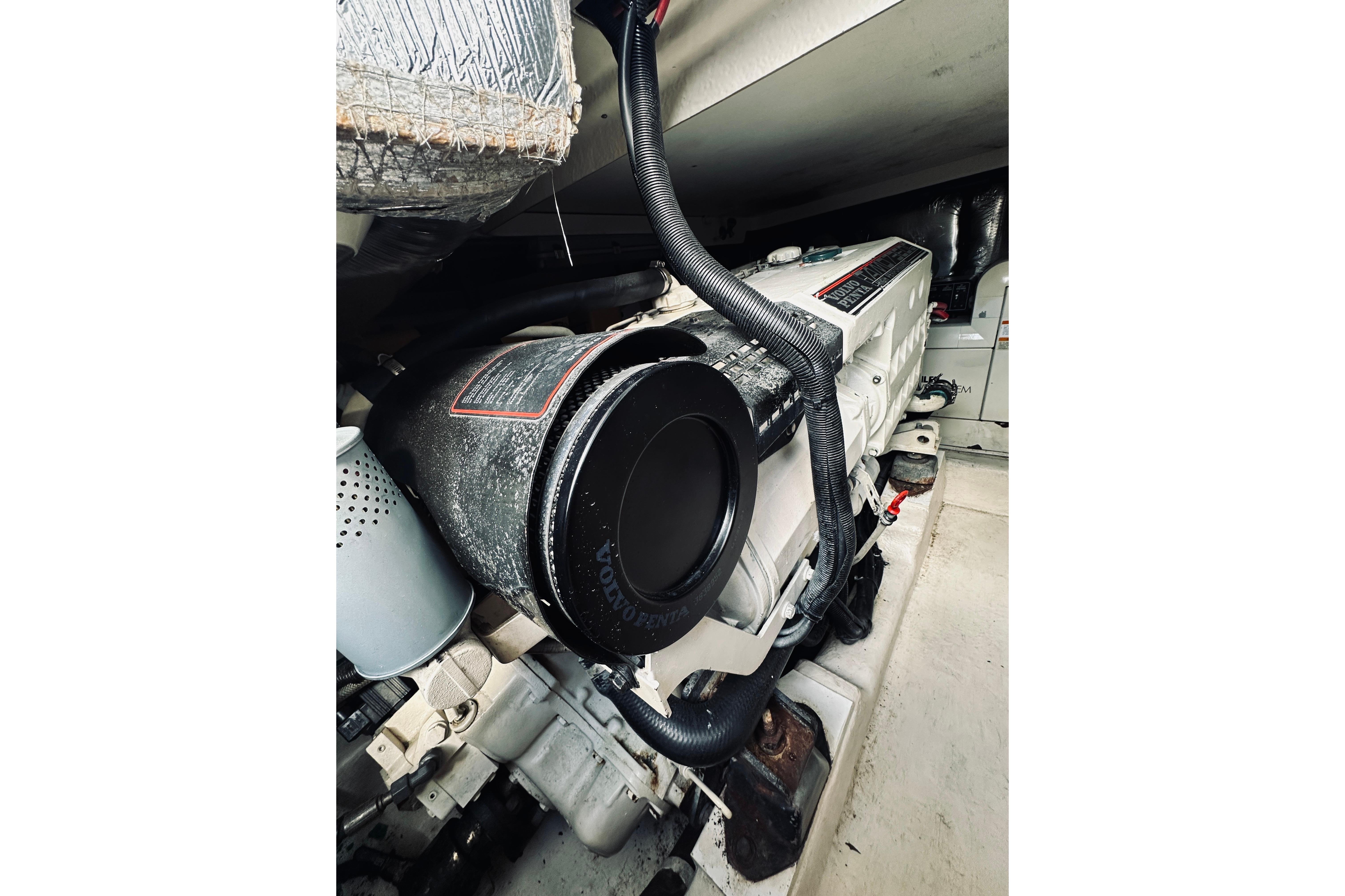 Engine compartment of a 2000 Riviera 40 boat, showcasing detailed mechanical components.