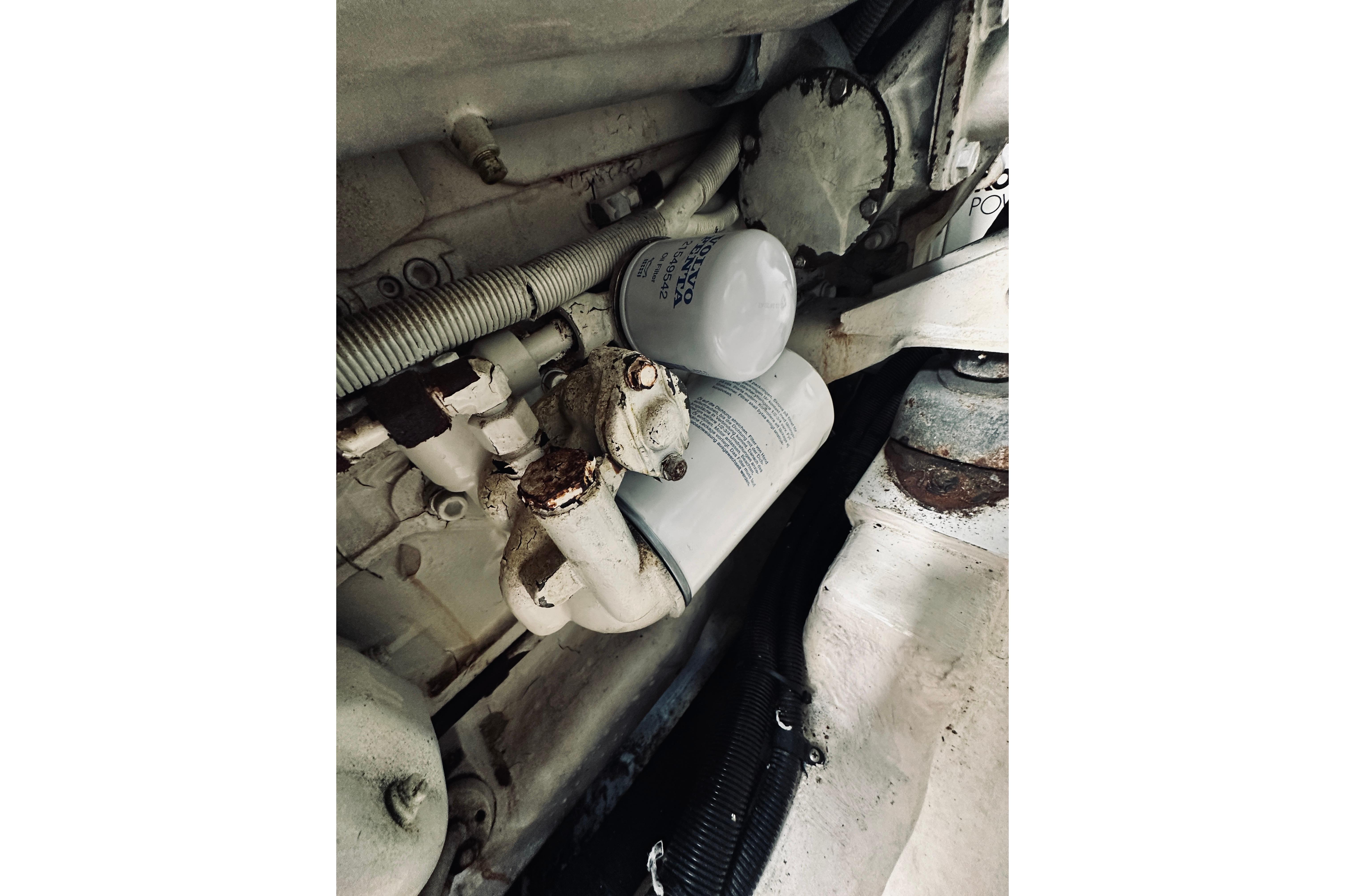 Engine compartment of 2000 Riviera 40 boat showing filters and hoses.