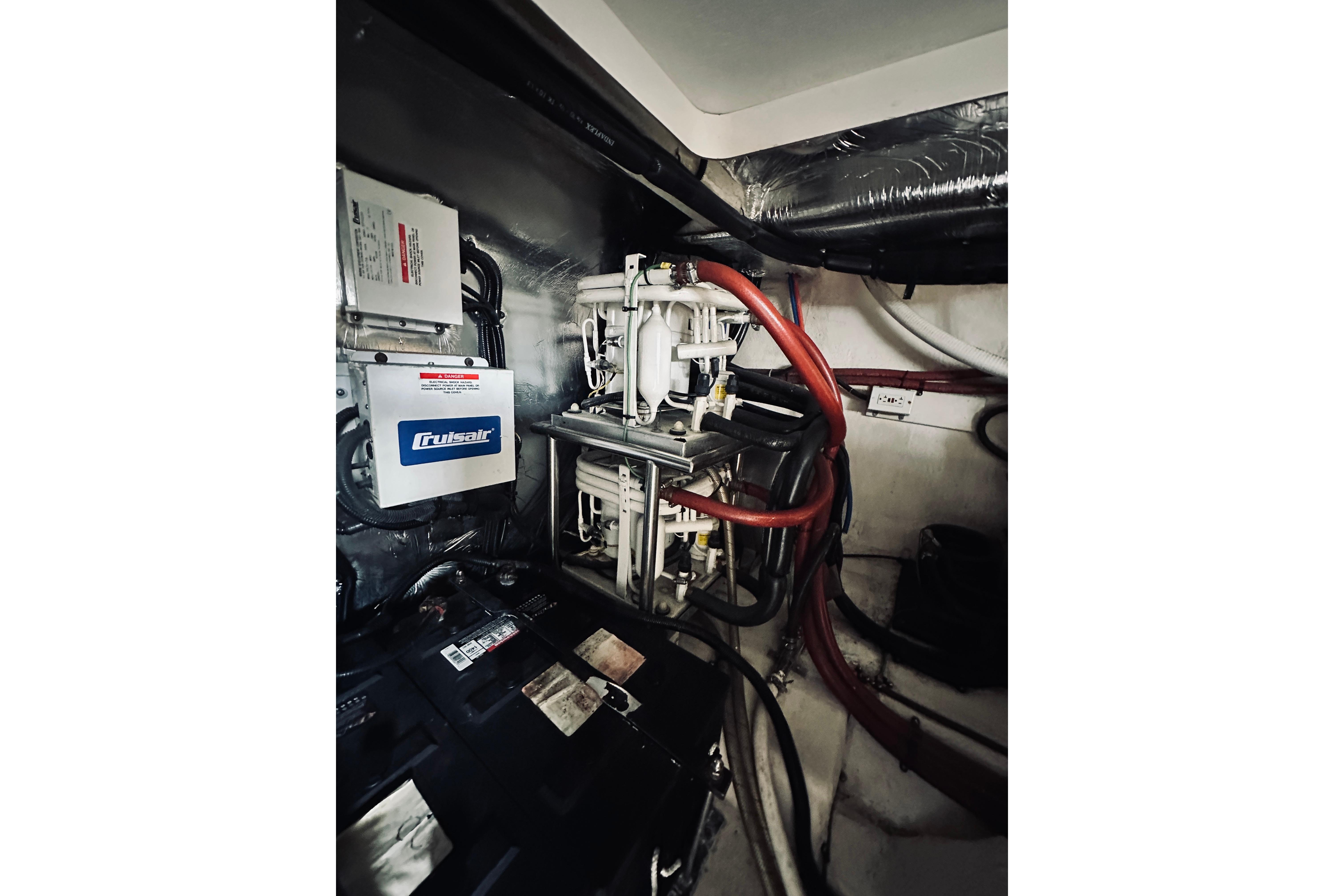Engine room of 2000 Riviera 40 yacht with Cruisair system and wiring.