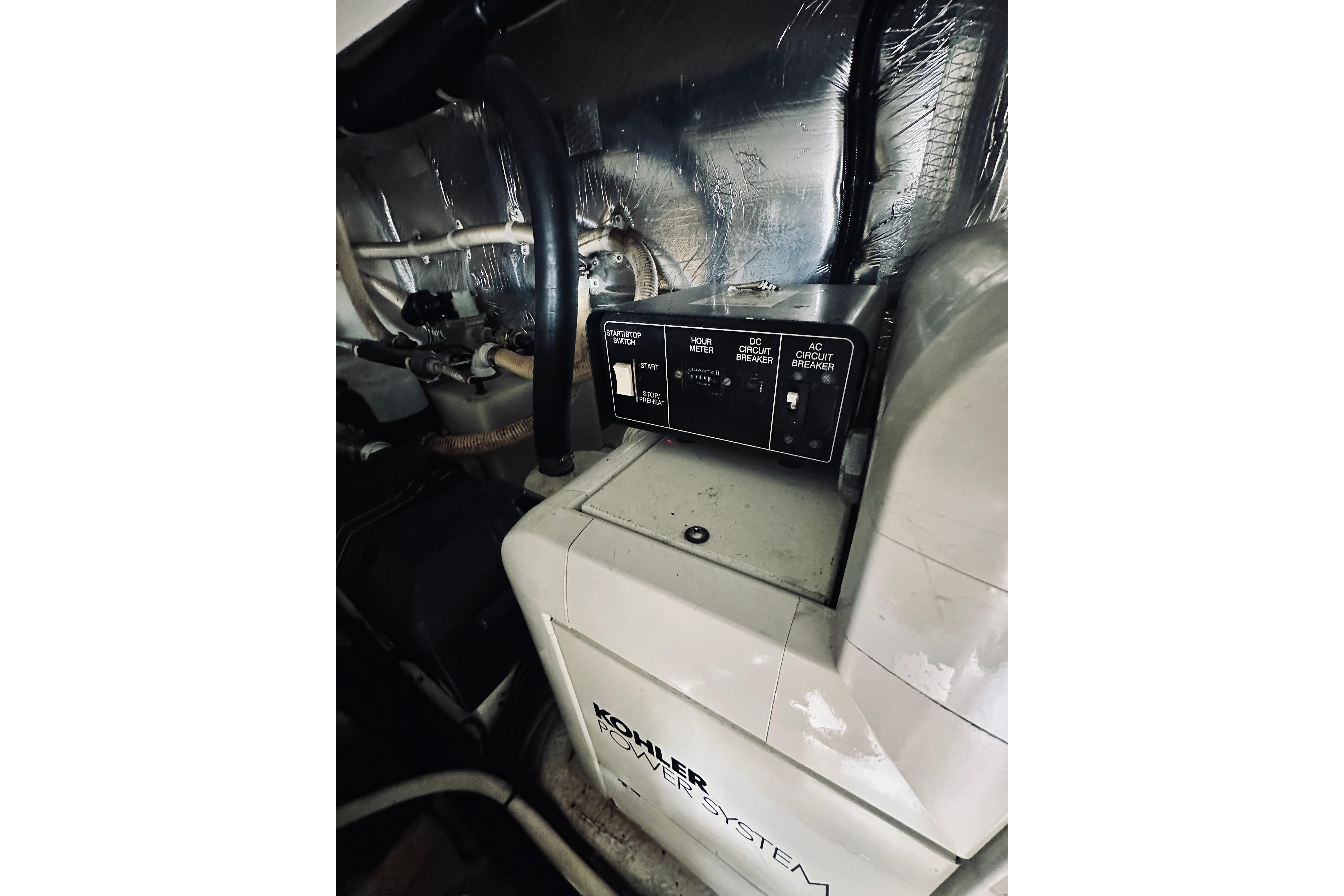 Engine room of 2000 Riviera 40 yacht with Kohler power system.