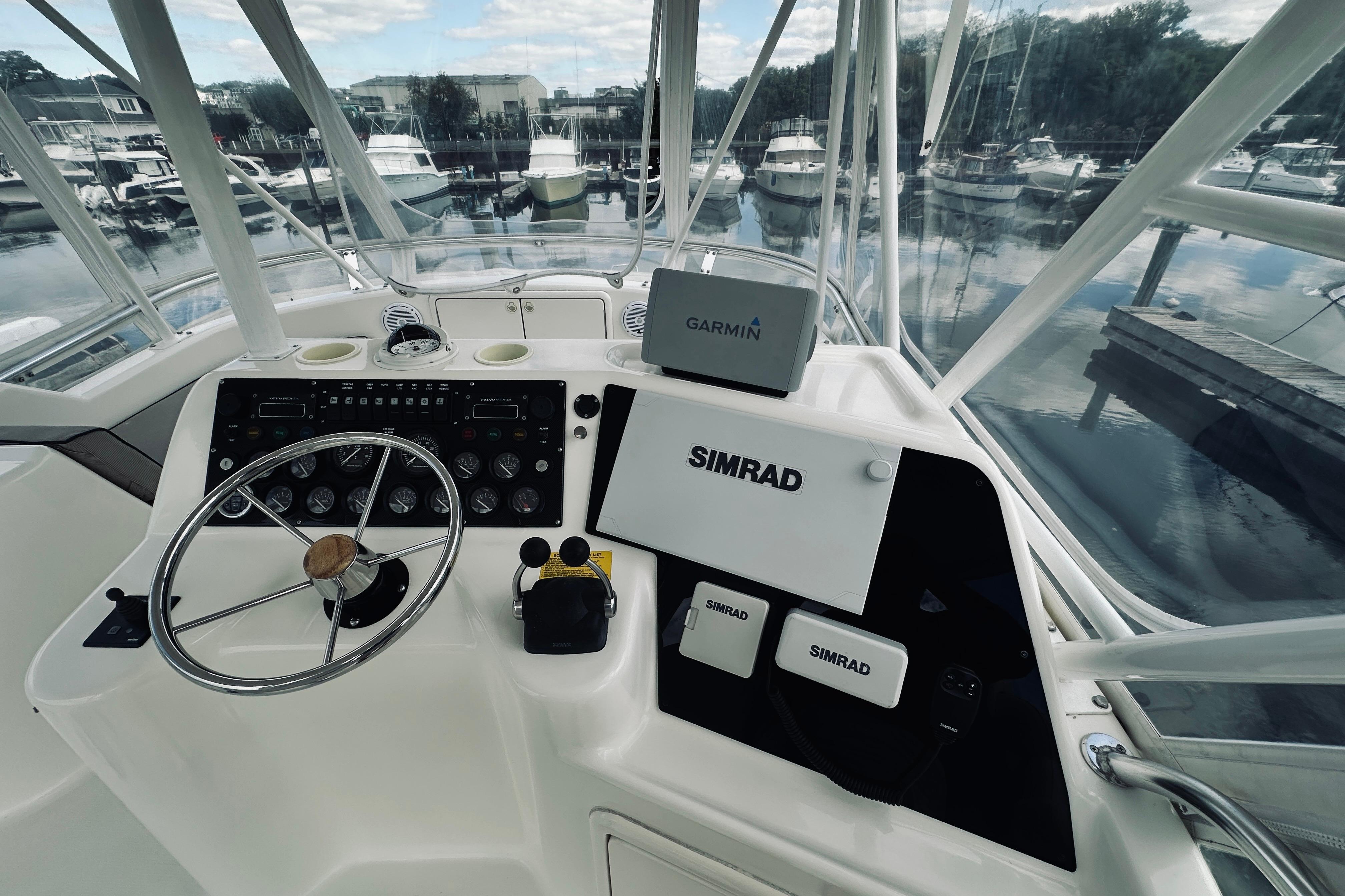 Helm of 2000 Riviera 40 yacht with Garmin and Simrad navigation systems.