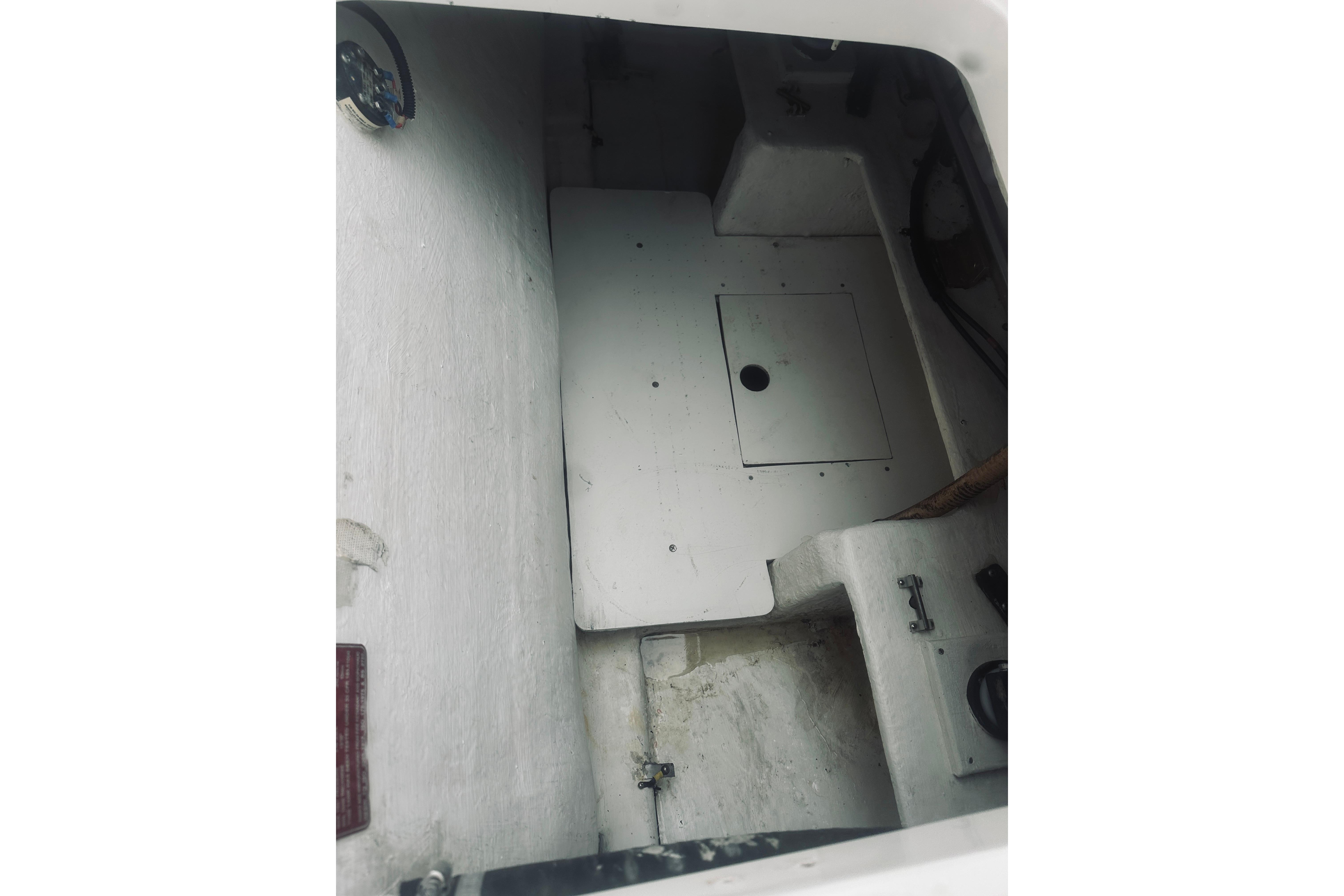 Interior view of a 2000 Riviera 40 boat, showcasing storage compartment.