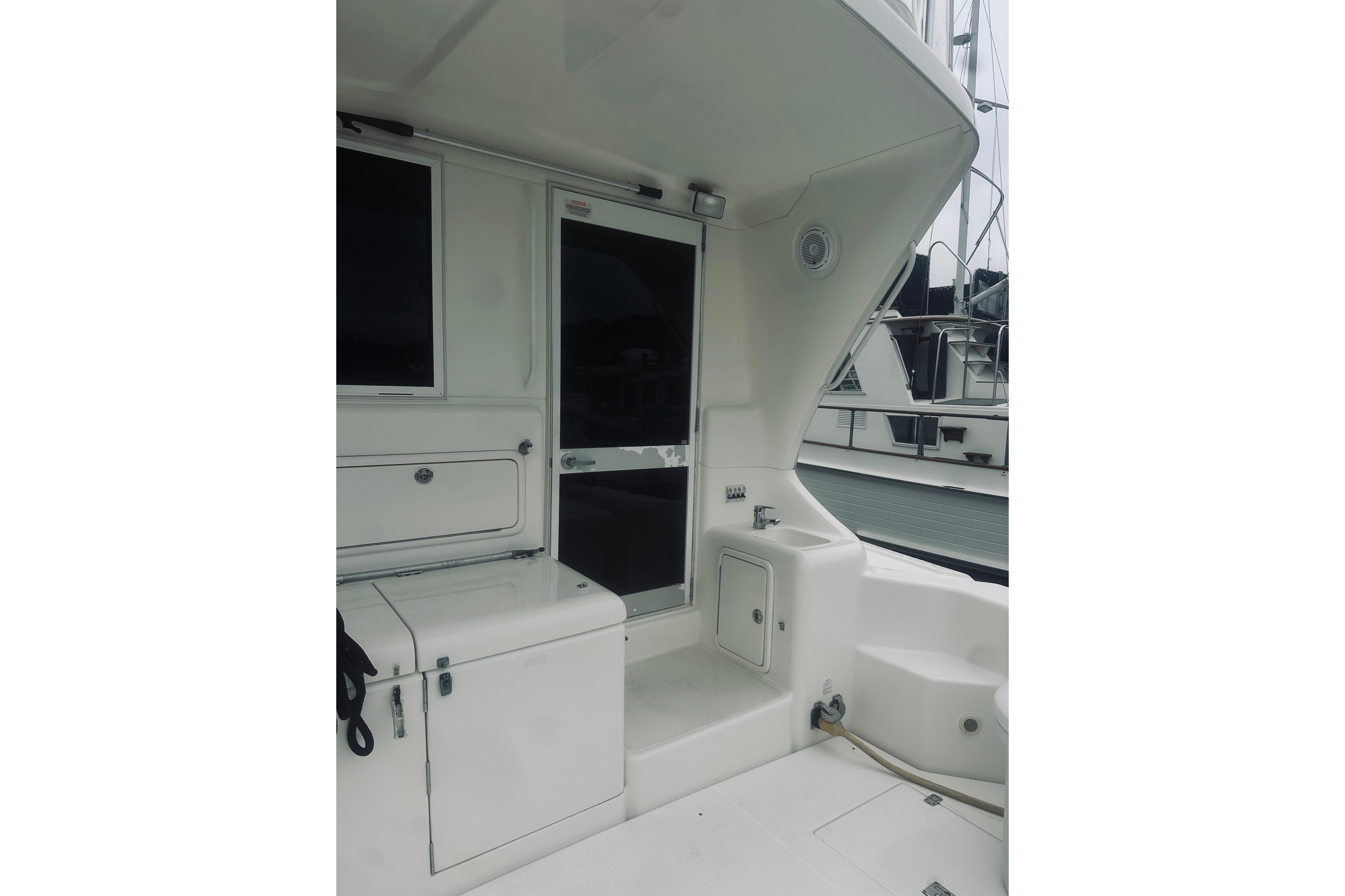 2000 Riviera 40 yacht deck area with storage compartments and seating.