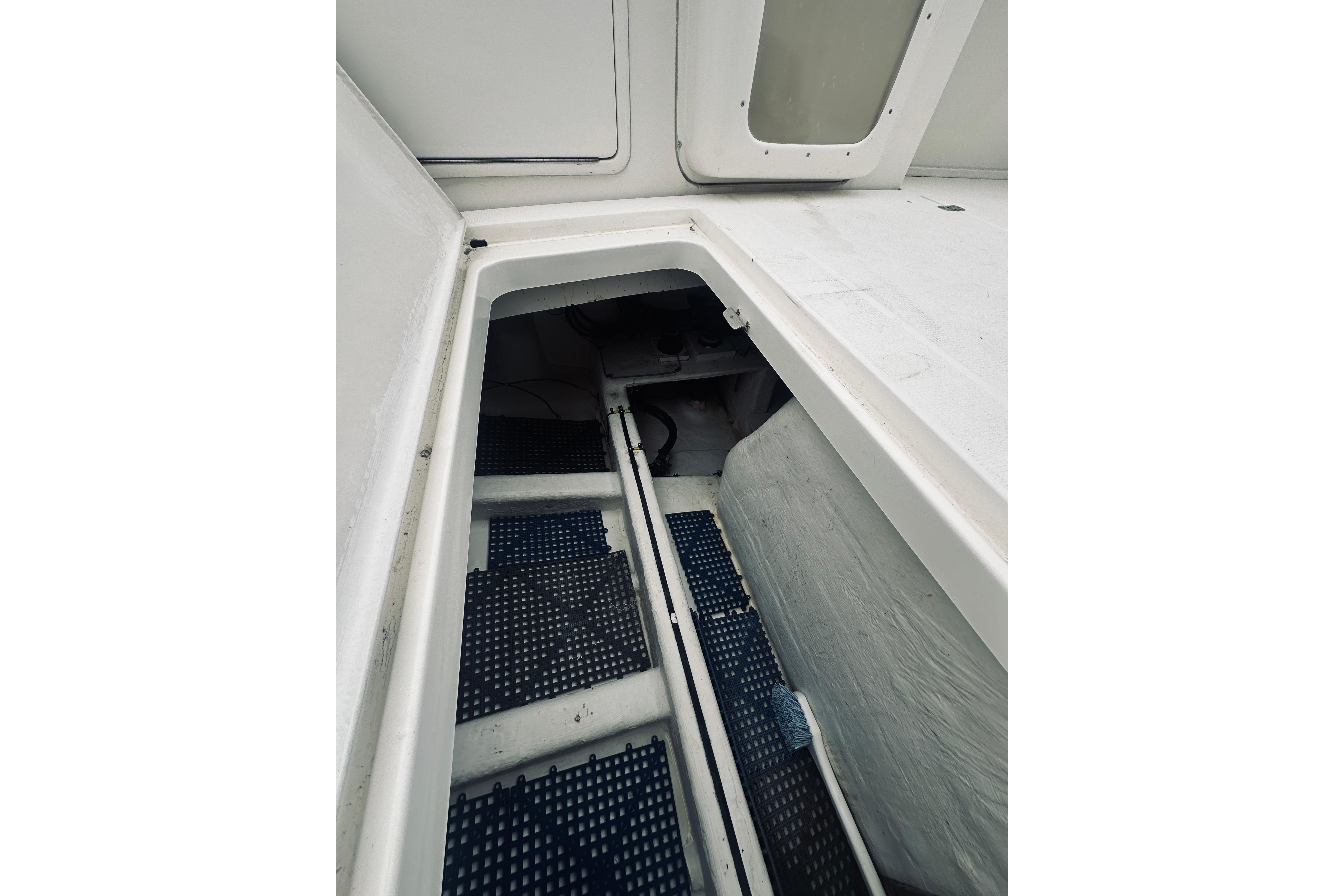 Interior view of a 2000 Riviera 40 boat compartment with storage space.