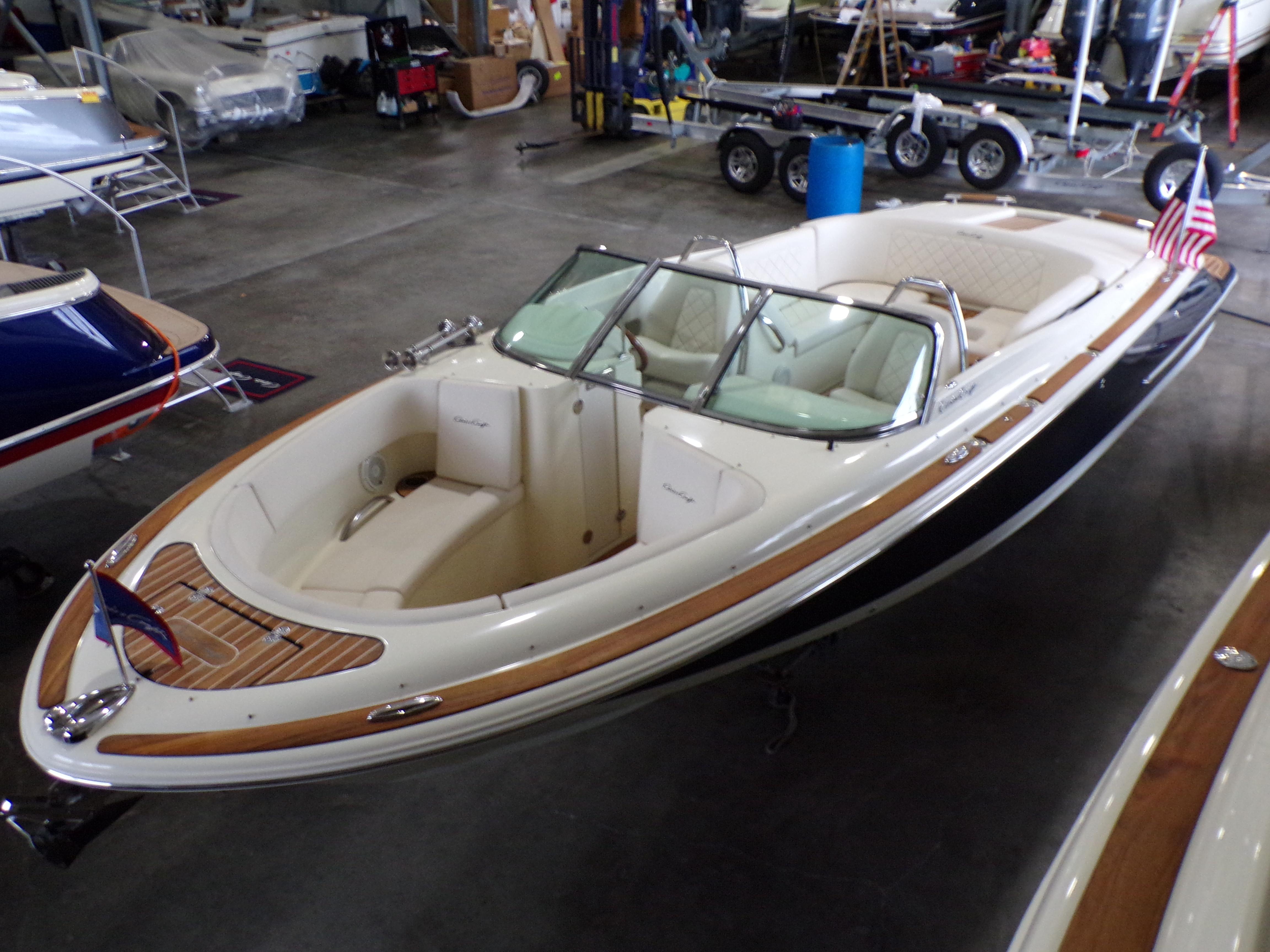 2021 Chris-Craft Launch 27 boat in a storage facility.