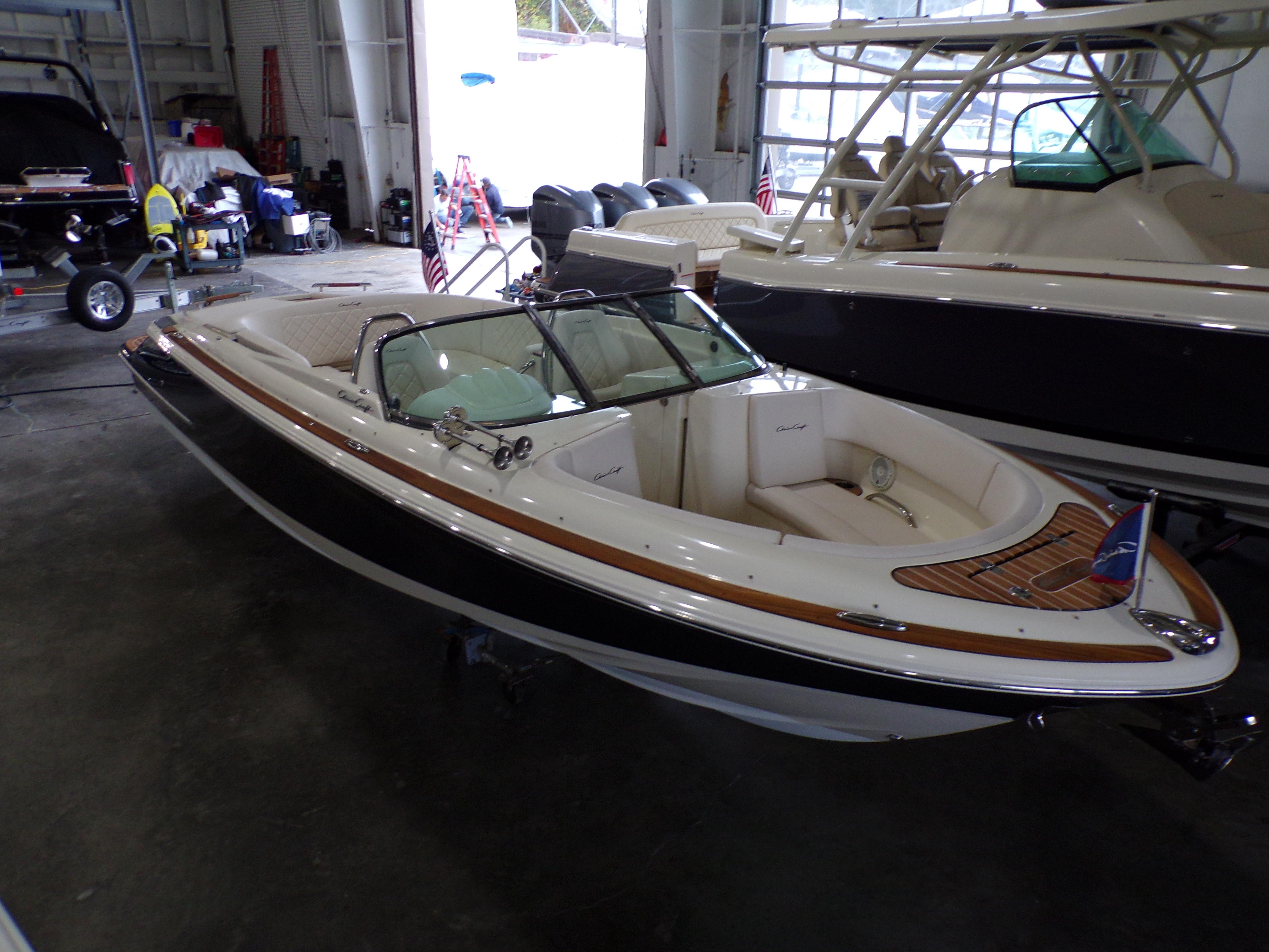 2021 Chris-Craft Launch 27 boat in a storage facility.