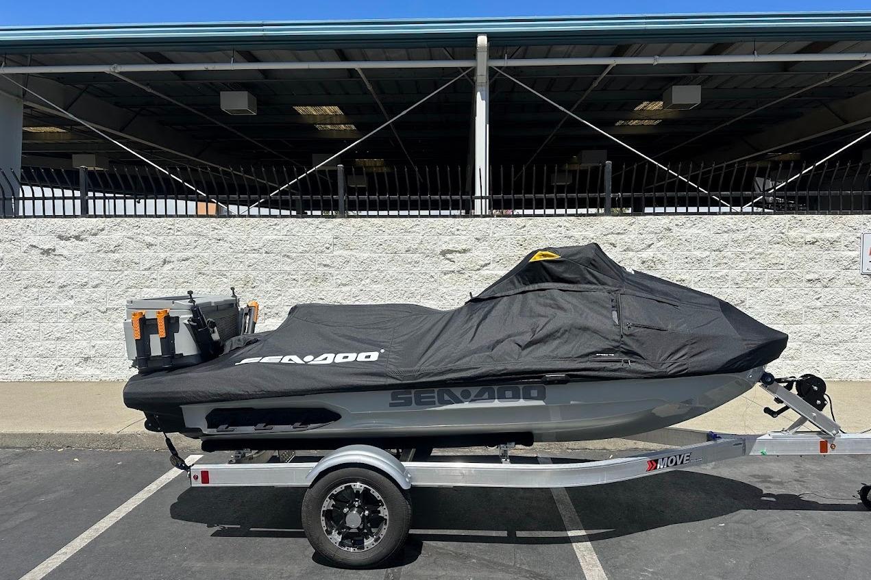 2023 Sea-Doo Fish Pro Trophy on trailer, covered, parked outdoors.