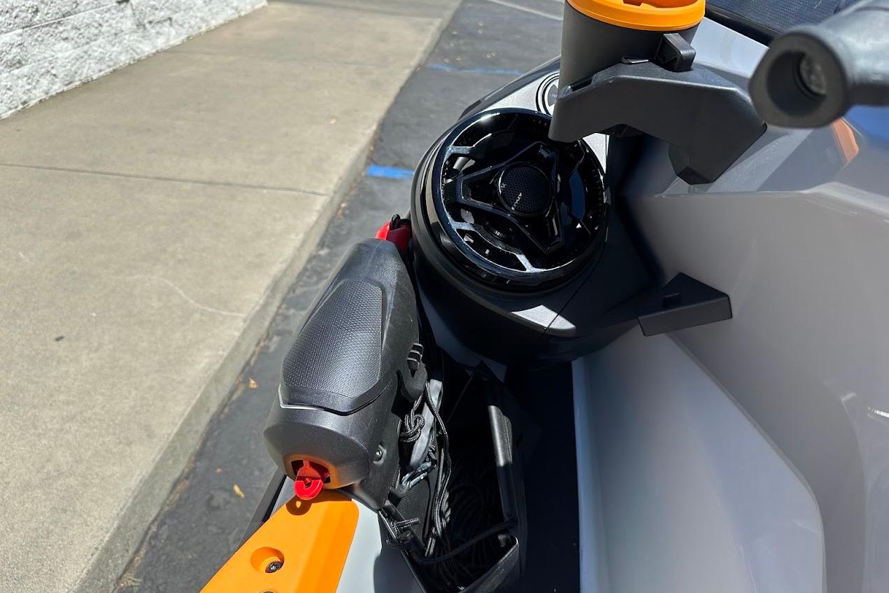 2023 Sea-Doo Fish Pro Trophy handlebar and speaker detail in sunlight.