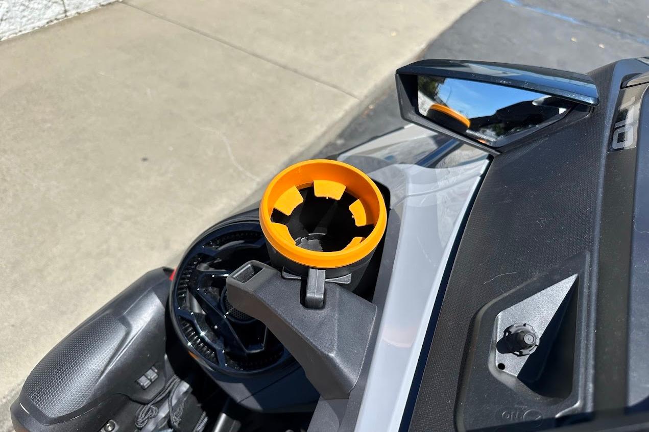 2023 Sea-Doo Fish Pro Trophy dashboard with orange cup holder and side mirror.