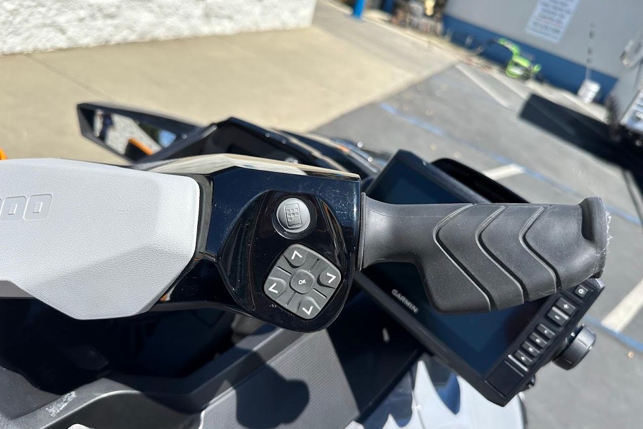 2023 Sea-Doo Fish Pro Trophy handlebar with control buttons and display screen.