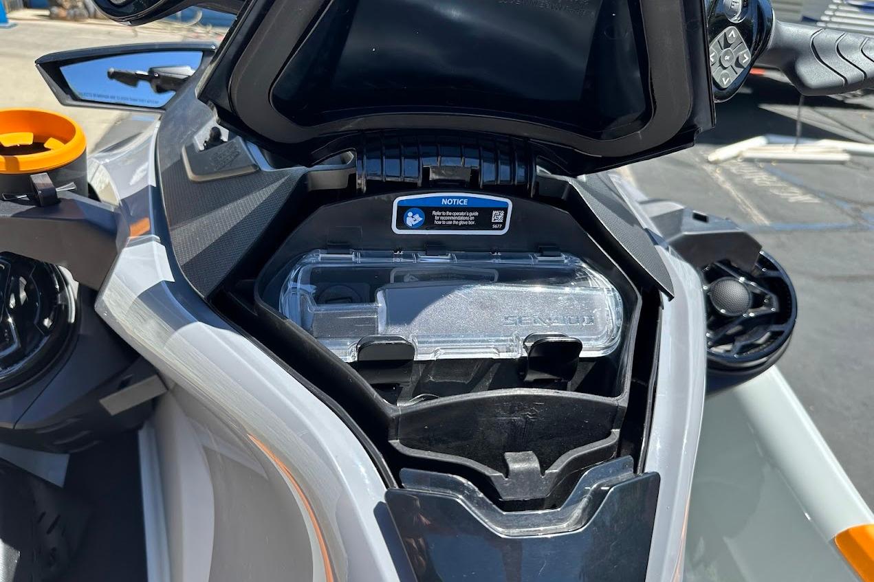 2023 Sea-Doo Fish Pro Trophy dashboard with storage compartment open.