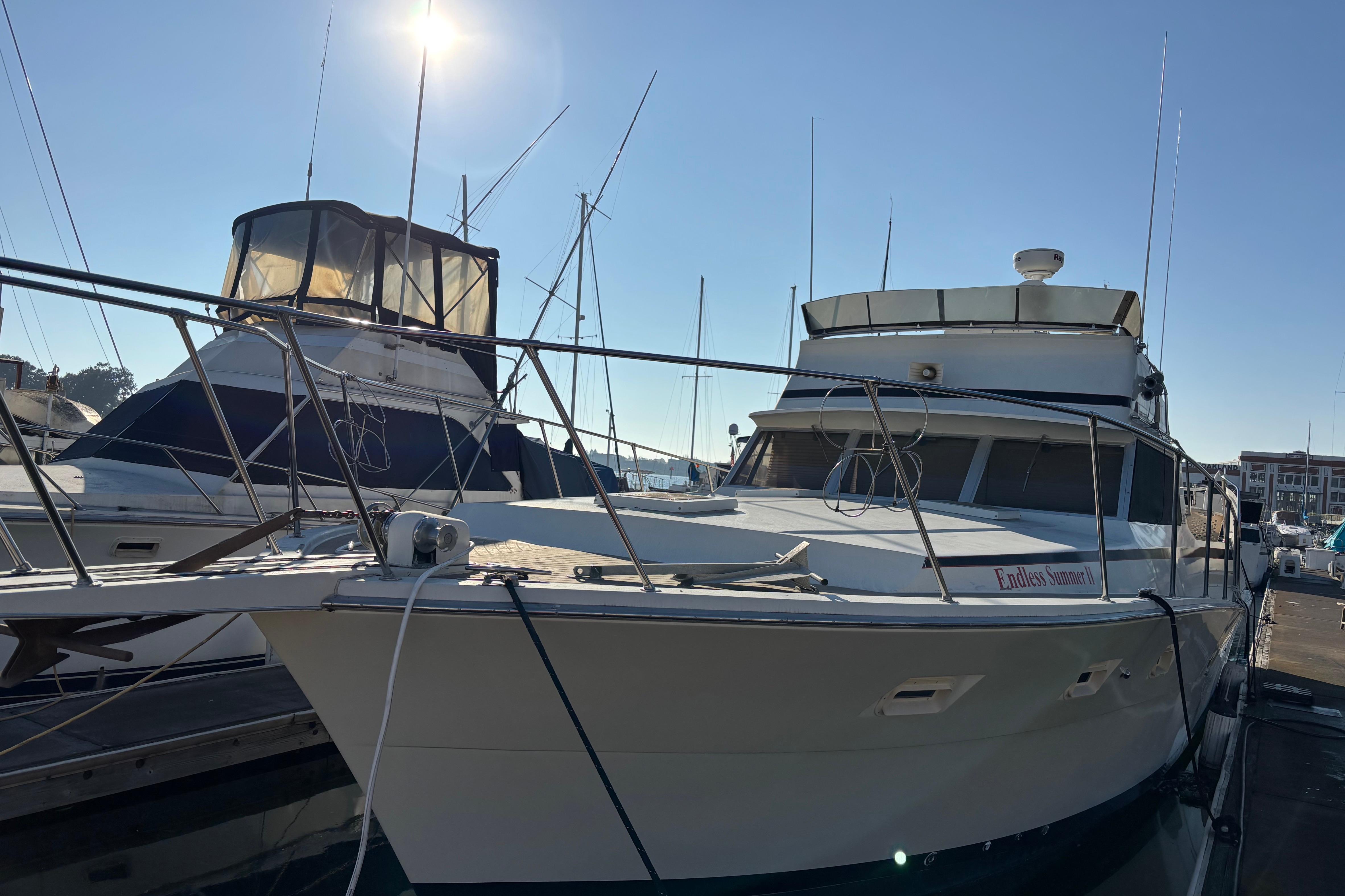 1979 Viking 43 yacht docked under clear sky, showcasing sleek design and spacious deck.