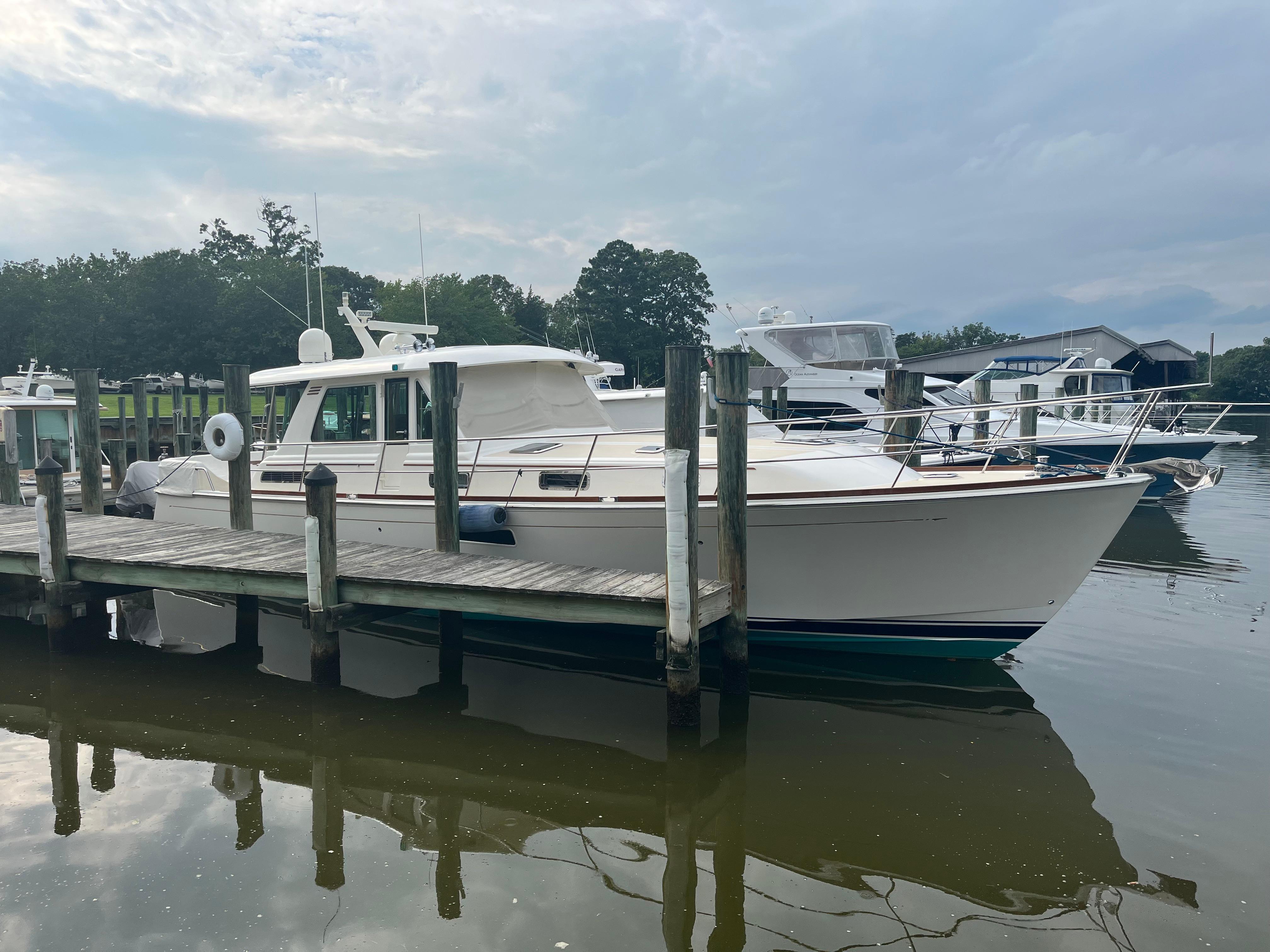 2021 Sabre 48 Salon Express yacht docked at a marina.