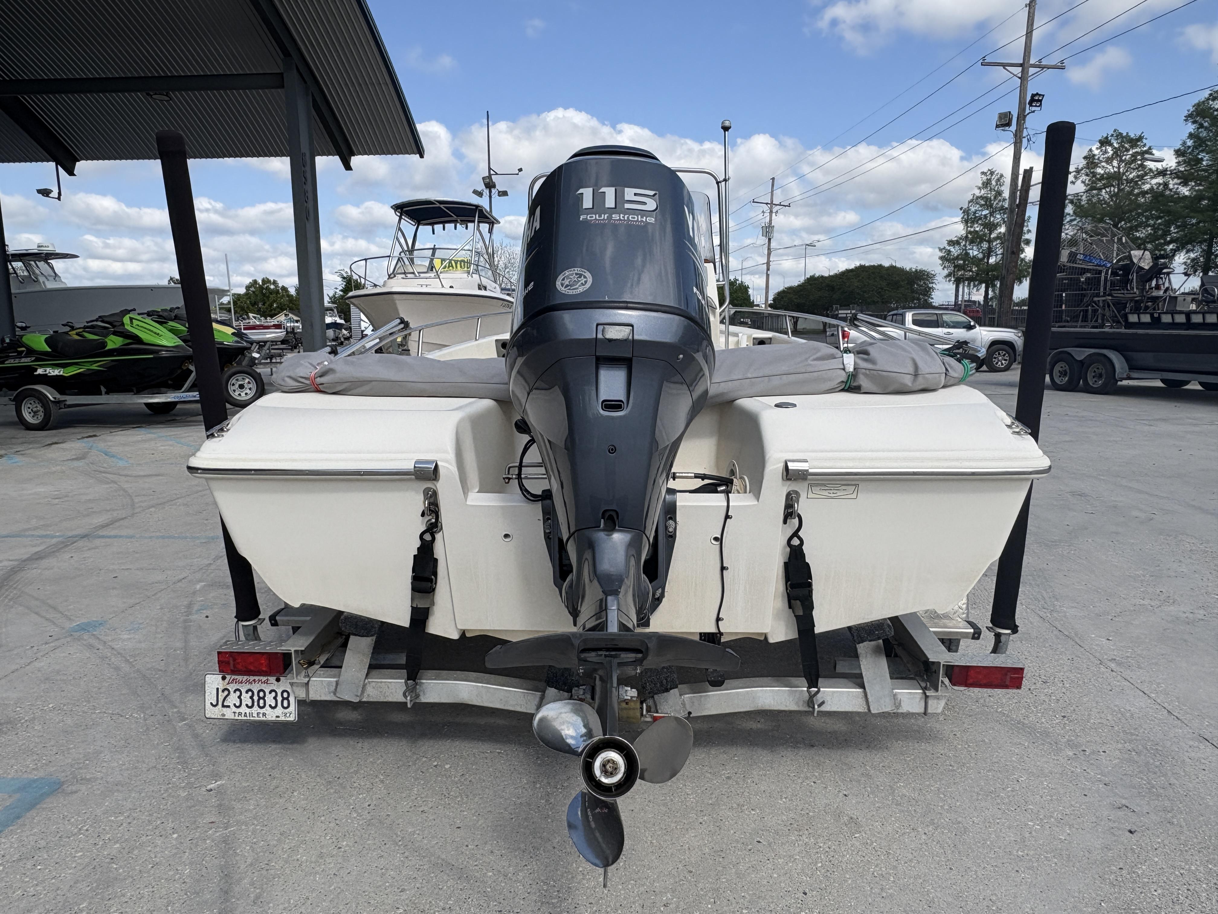 2005 Scout 17 boat with 115 horsepower outboard motor on a trailer.