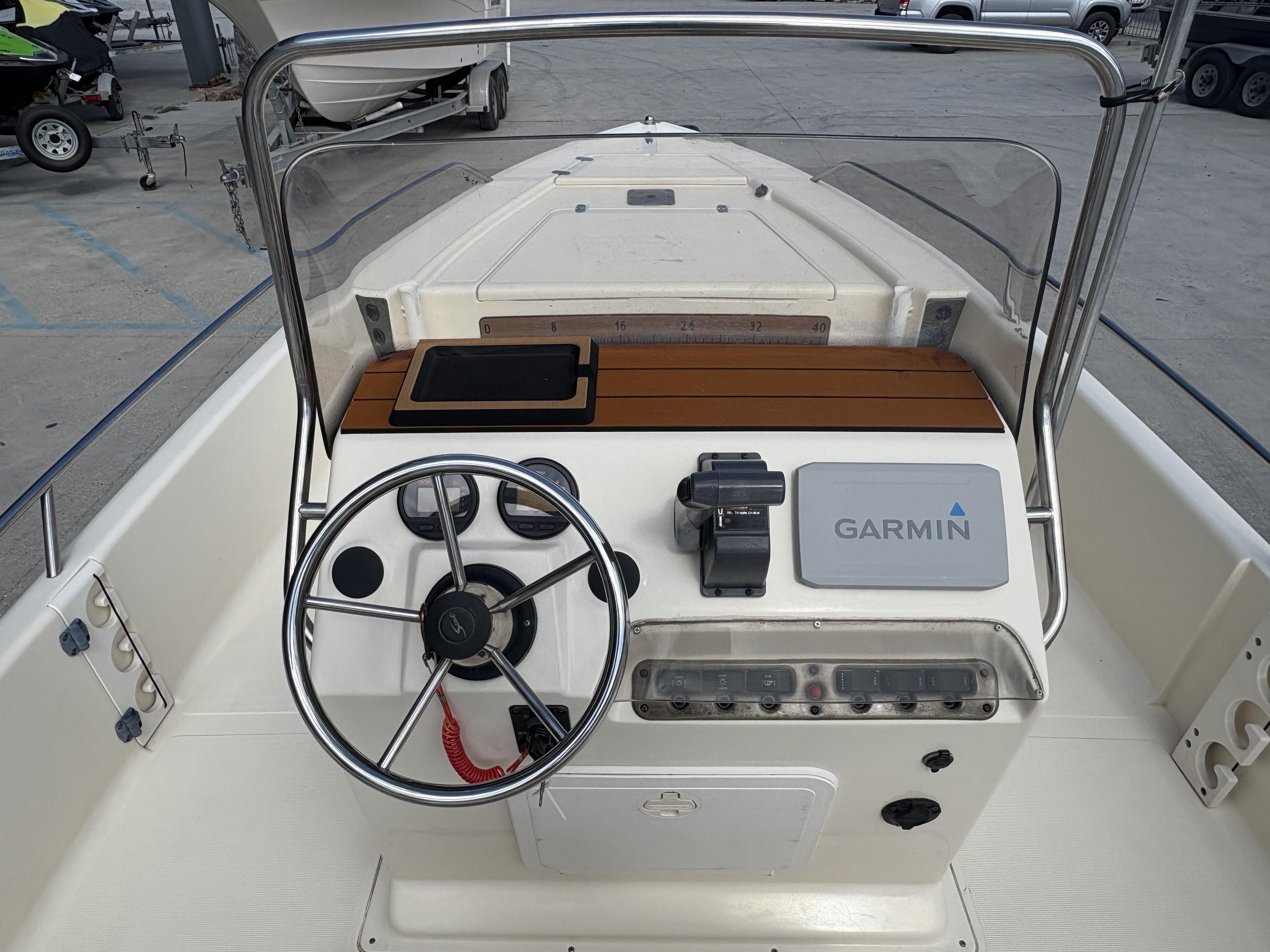 Scout 17 boat dashboard with Garmin navigation system, steering wheel, and controls, 2005 model.
