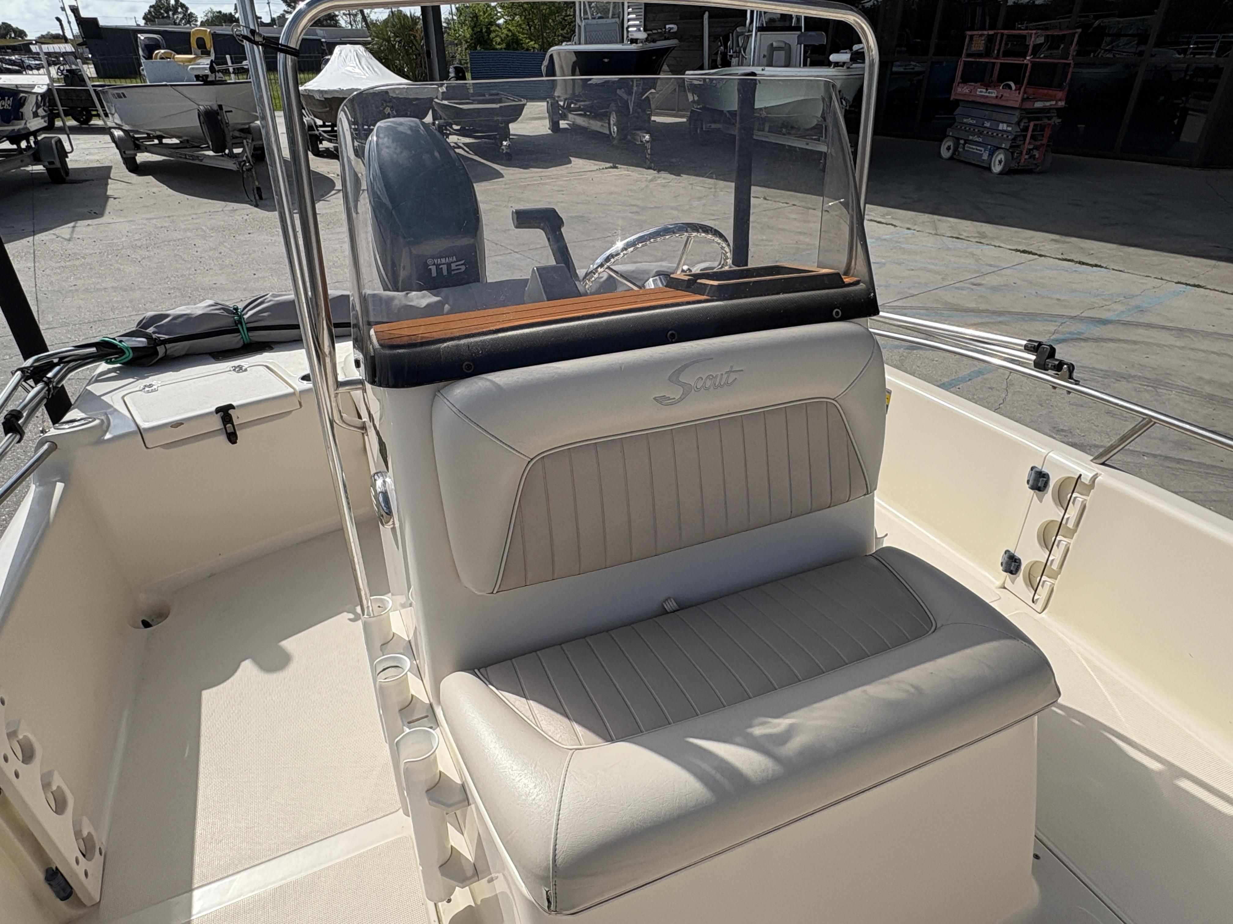 2005 Scout 17 boat interior with cushioned seating and Yamaha 115 engine.