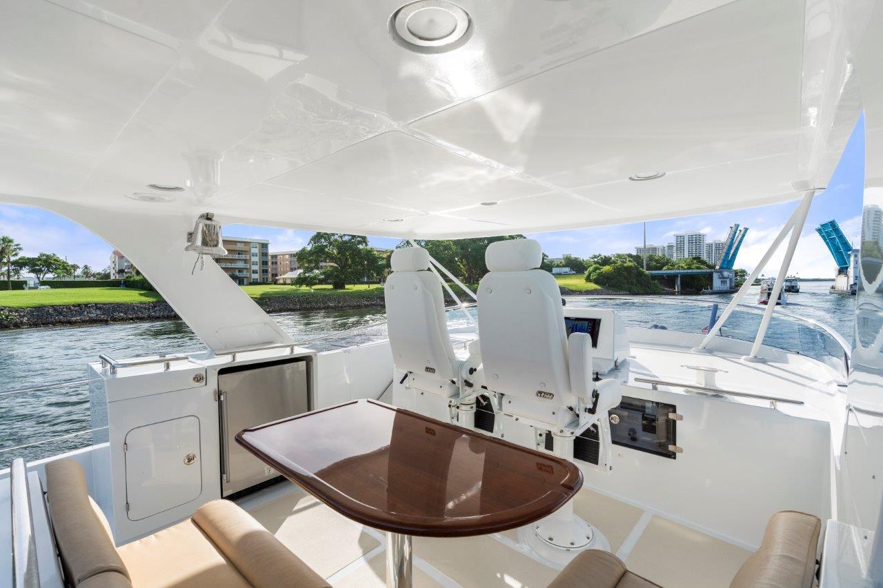 Instigator Yacht Photos Pics Marlow 49 Instigator - Flybridge, Table and Helm Seats