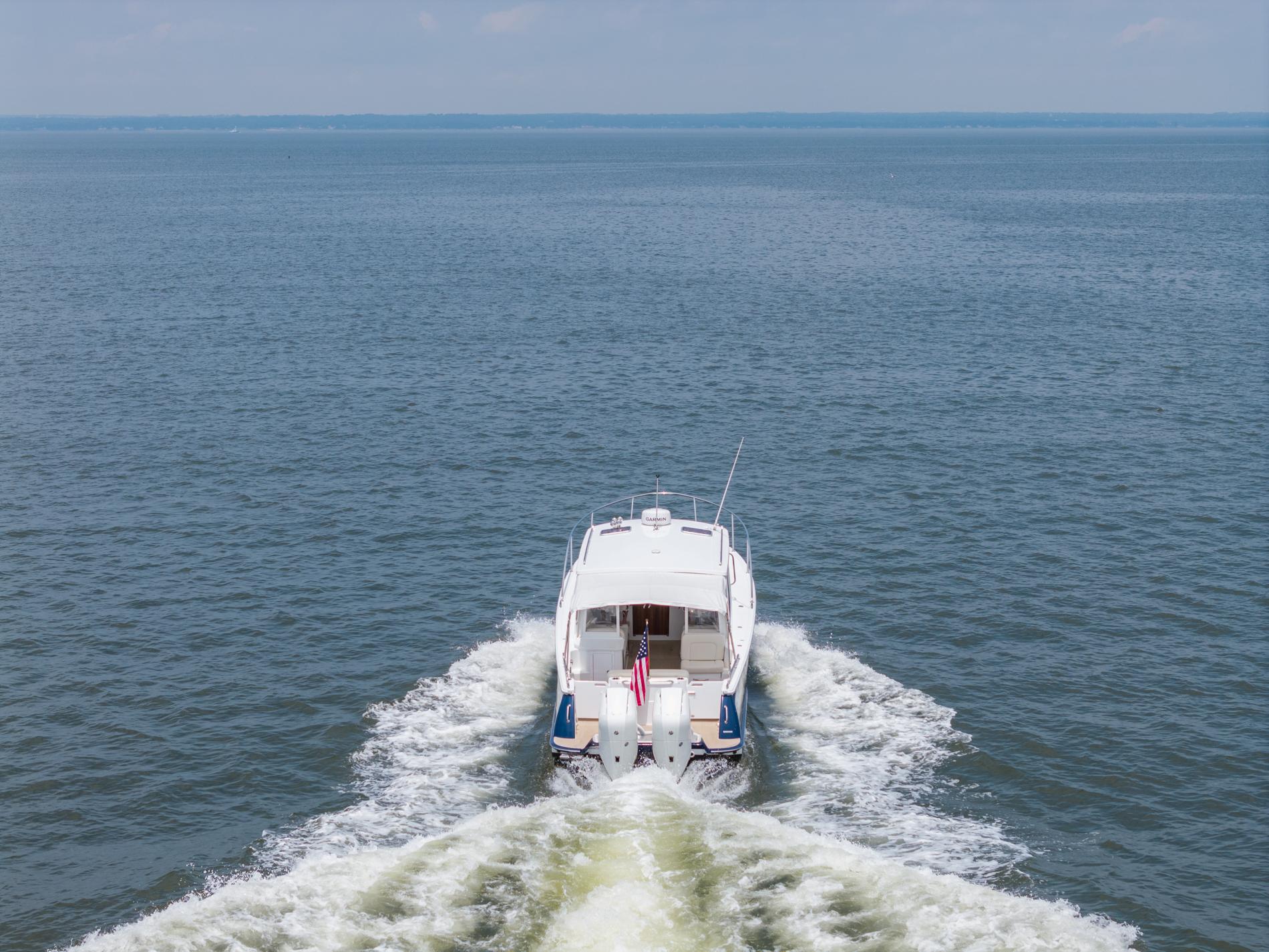 2025 MJM 35 boat cruising on open water, leaving a wake behind.