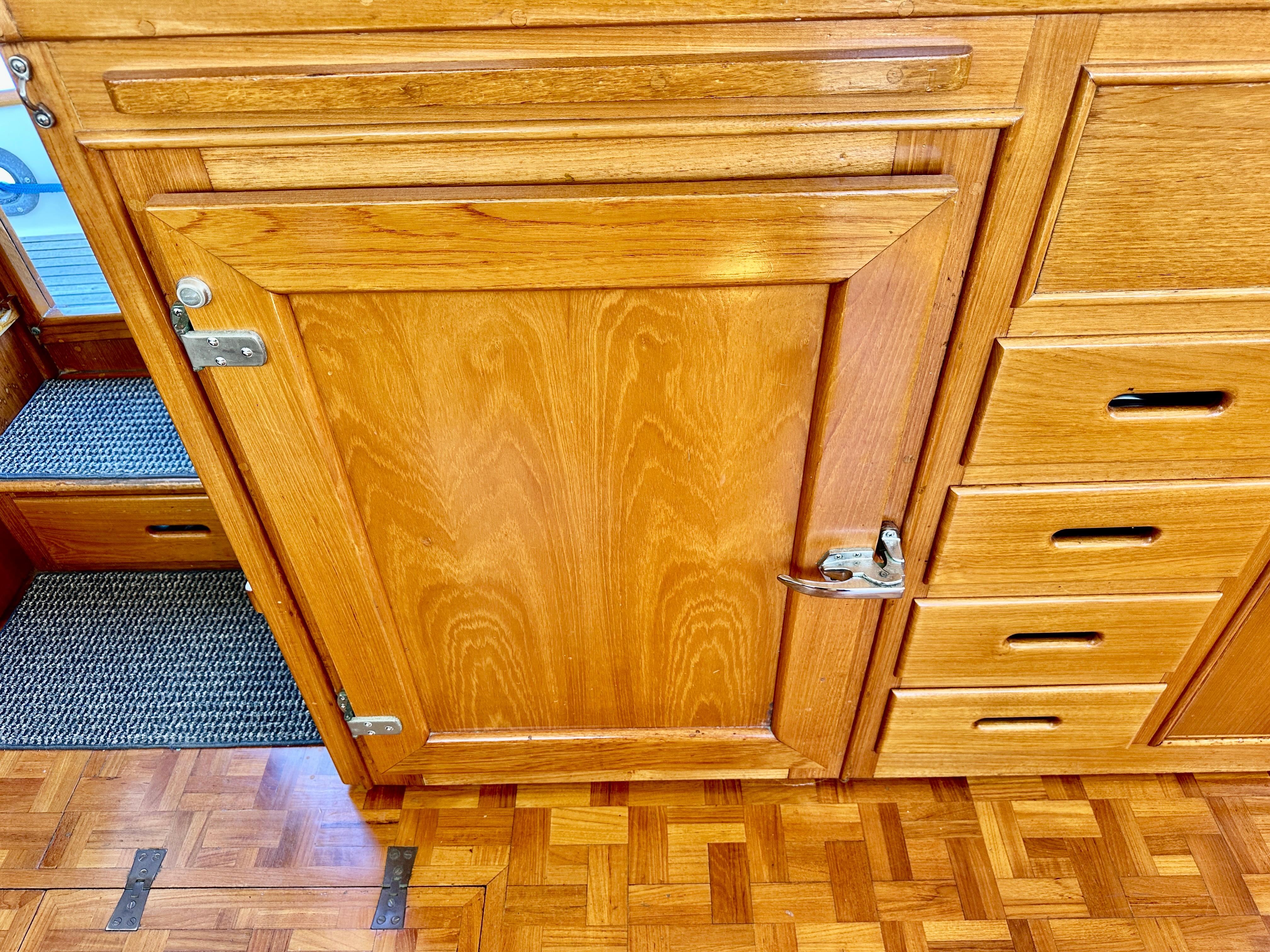 Wooden cabinetry on a 1989 Grand Banks 42 Classic yacht interior.