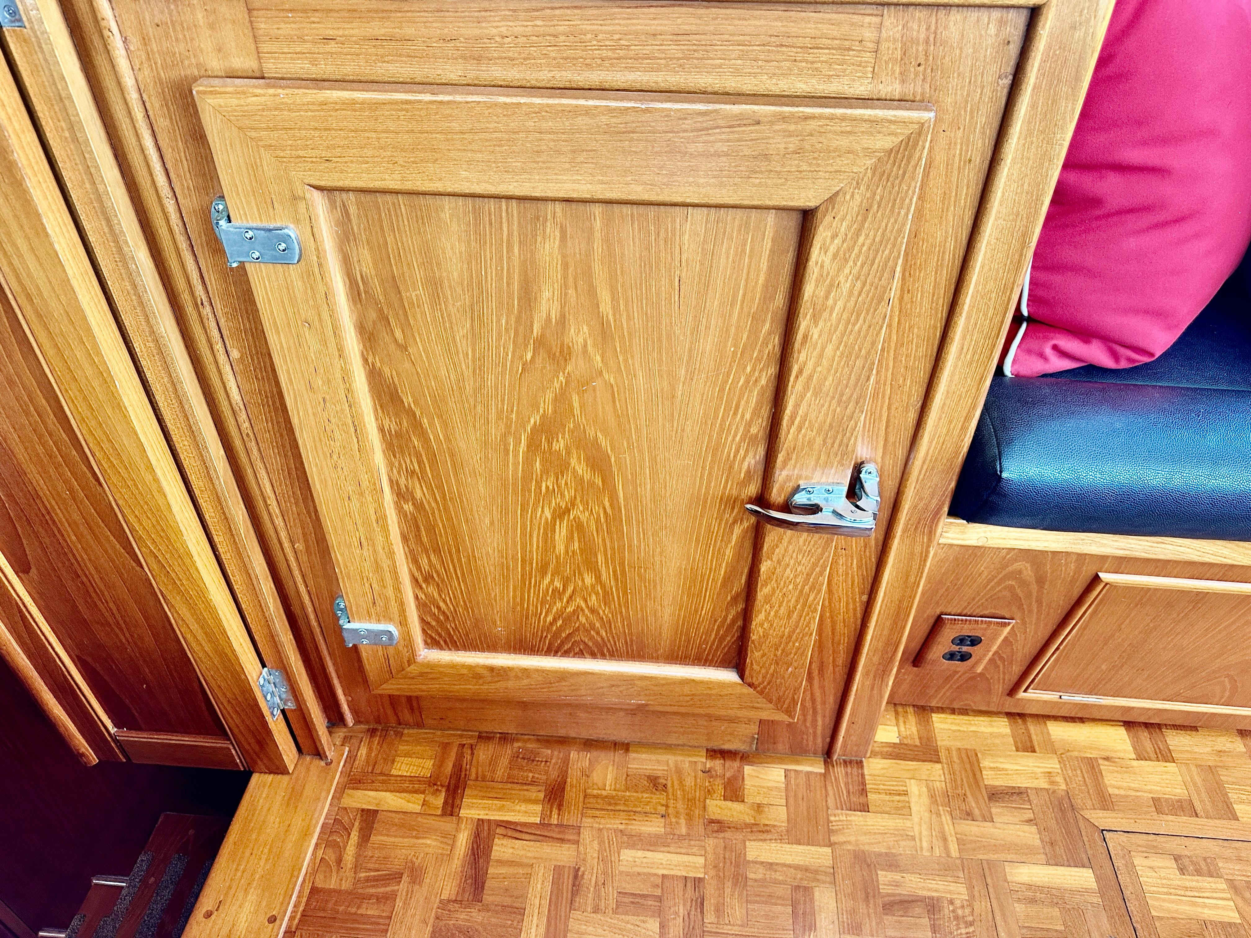 Wooden interior of 1989 Grand Banks 42 Classic yacht with parquet flooring.