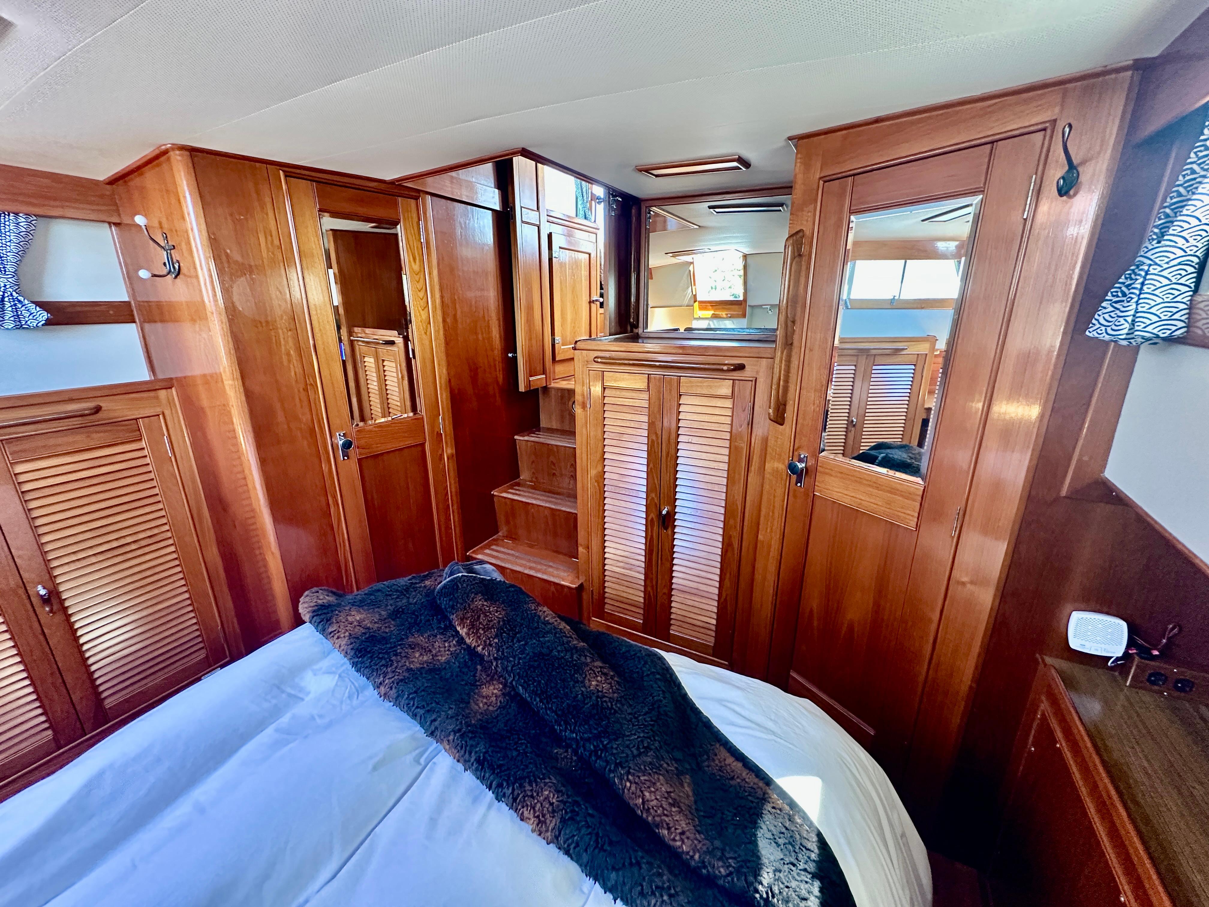 Luxurious wood interior of 1989 Grand Banks 42 Classic yacht cabin.