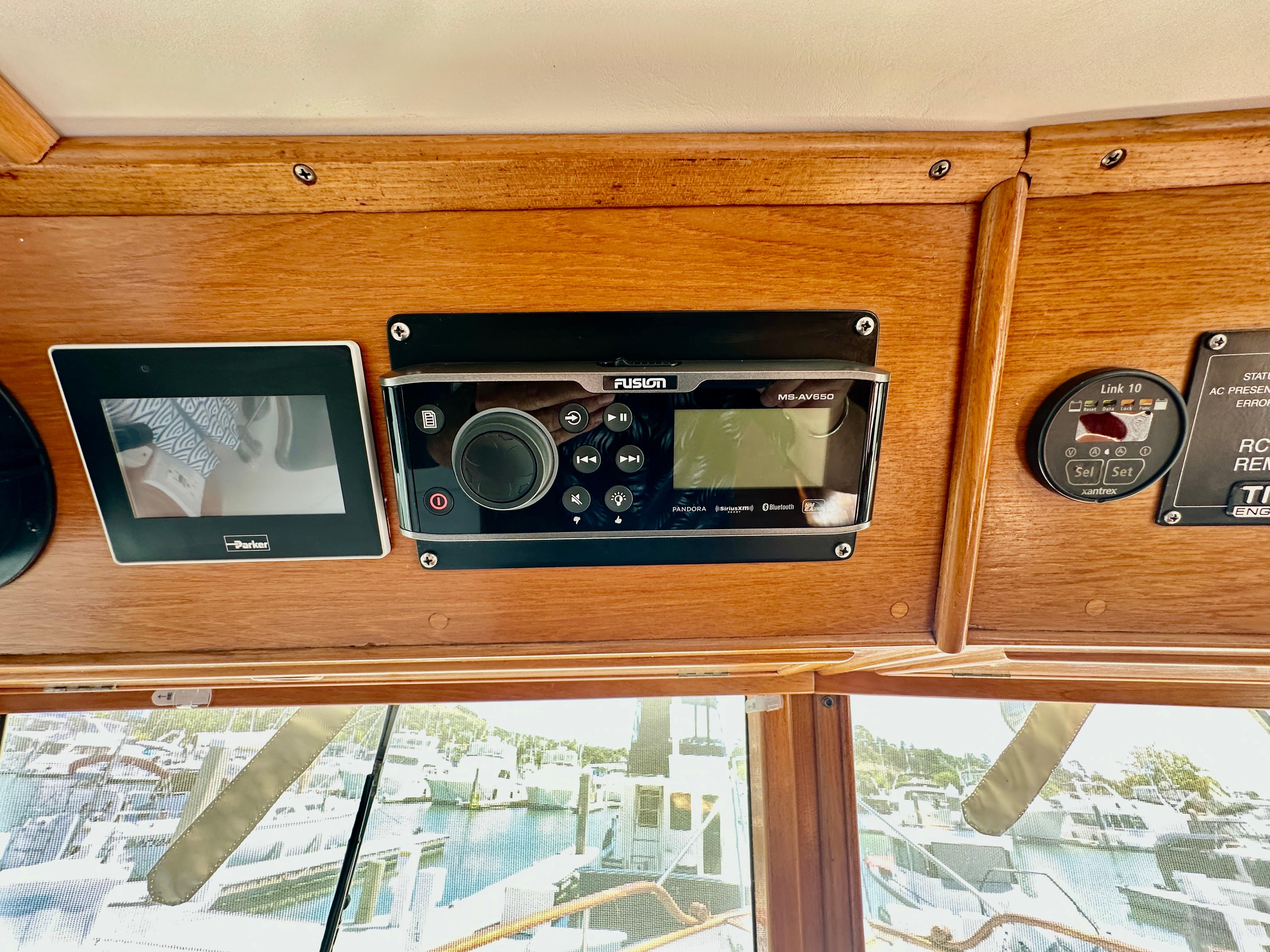 Control panel of a 1989 Grand Banks 42 Classic yacht with electronic displays.