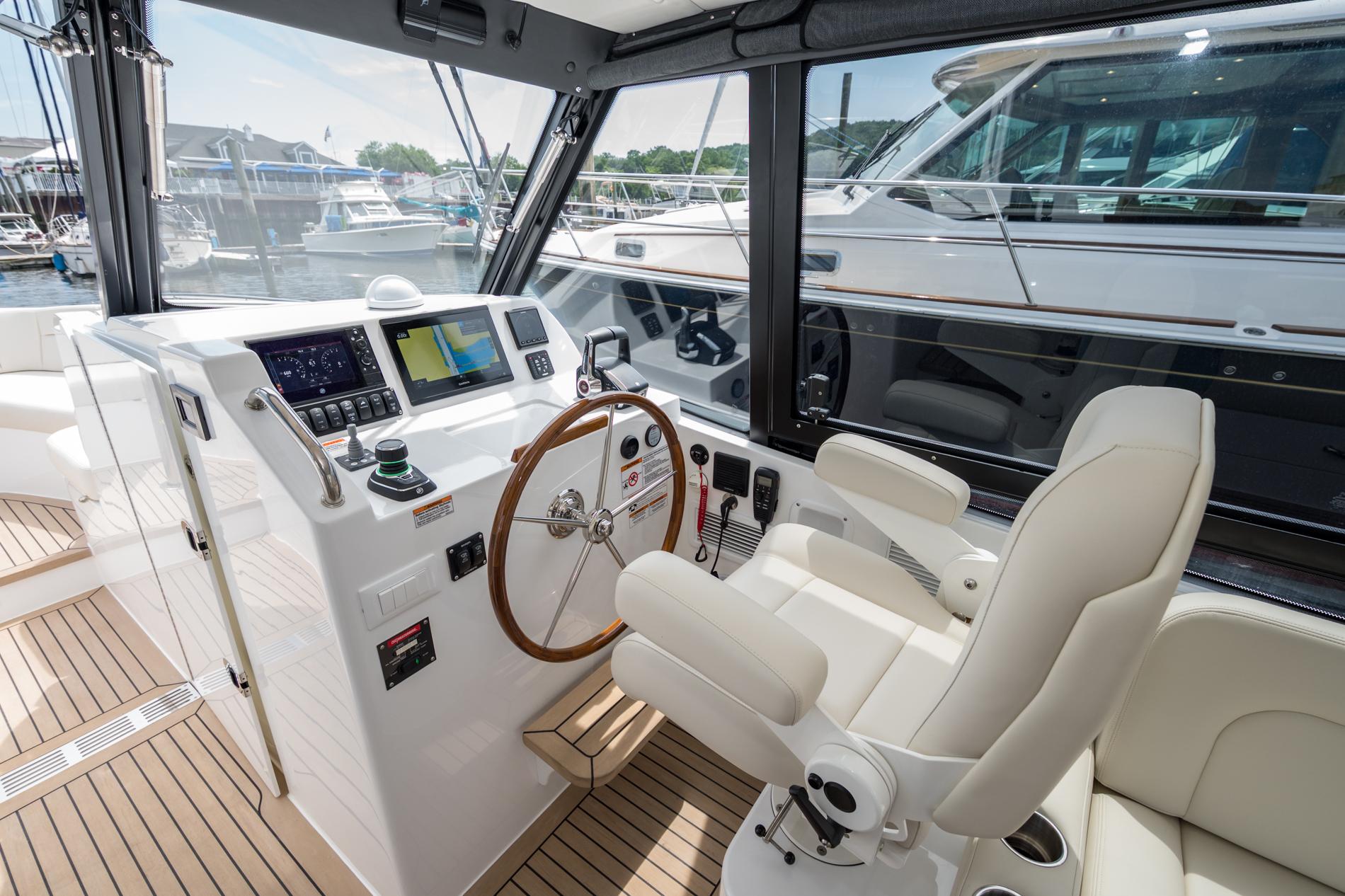 Luxurious 2025 MJM 3 yacht cockpit with modern navigation system and plush seating.