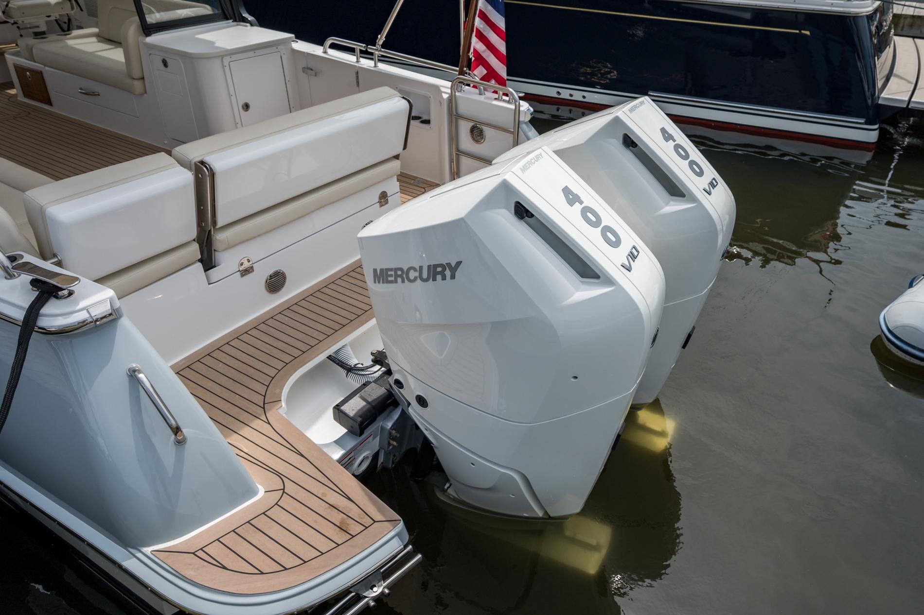 2025 MJM 3 boat with twin Mercury 400 V10 outboard engines, docked in water.