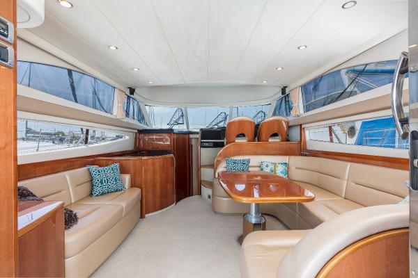 Luxurious interior of a 2007 Viking Sport Cruiser yacht with elegant seating and dining area.