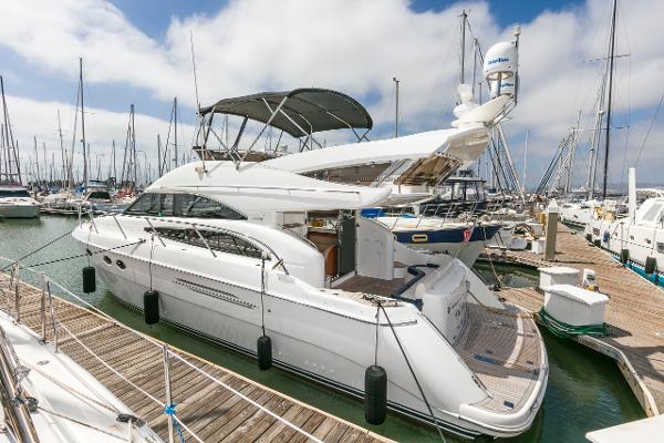 2007 Viking Sport Cruiser yacht docked at marina, featuring sleek design and spacious deck.