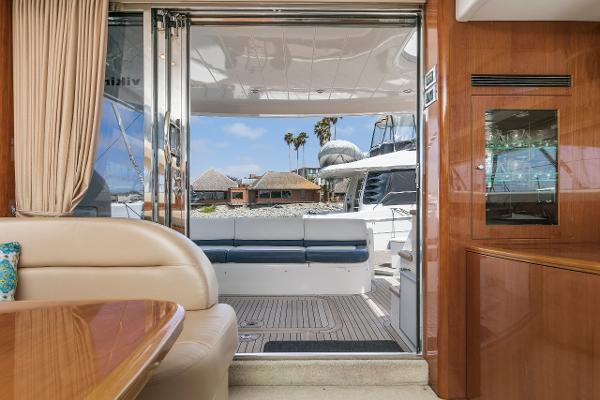 Interior view of a 2007 Viking Sport Cruiser yacht, featuring elegant seating and a scenic outdoor view.