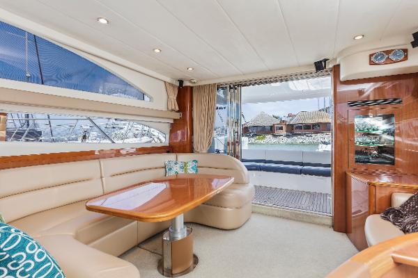Luxurious interior of a 2007 Viking Sport Cruiser yacht with elegant seating and wooden accents.