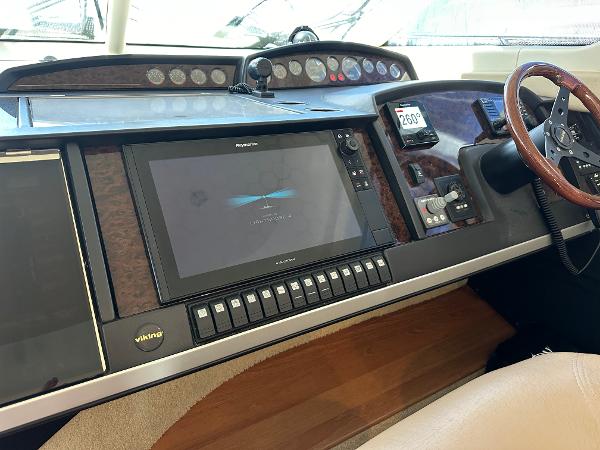 Control panel of a 2007 Viking Sport Cruiser with navigation and steering wheel.
