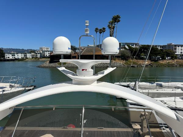 2007 Viking Sport Cruiser yacht docked in a marina with clear blue sky.