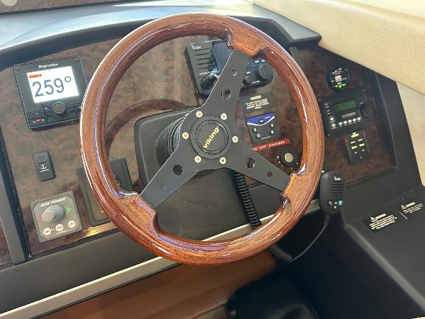 Steering wheel and dashboard of a 2007 Viking Sport Cruiser boat.