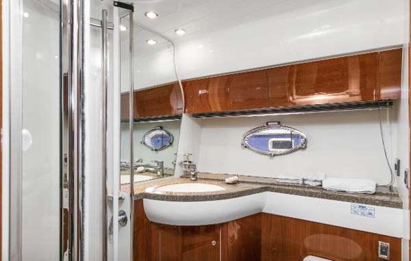 Luxurious bathroom interior of 2007 Viking Sport Cruiser with wood accents and modern fixtures.