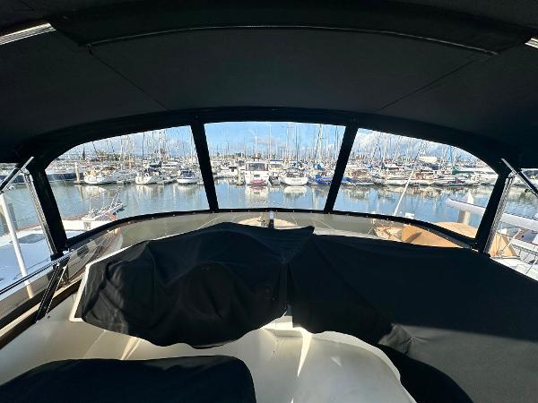 2007 Viking Sport Cruiser interior view overlooking marina with docked boats.