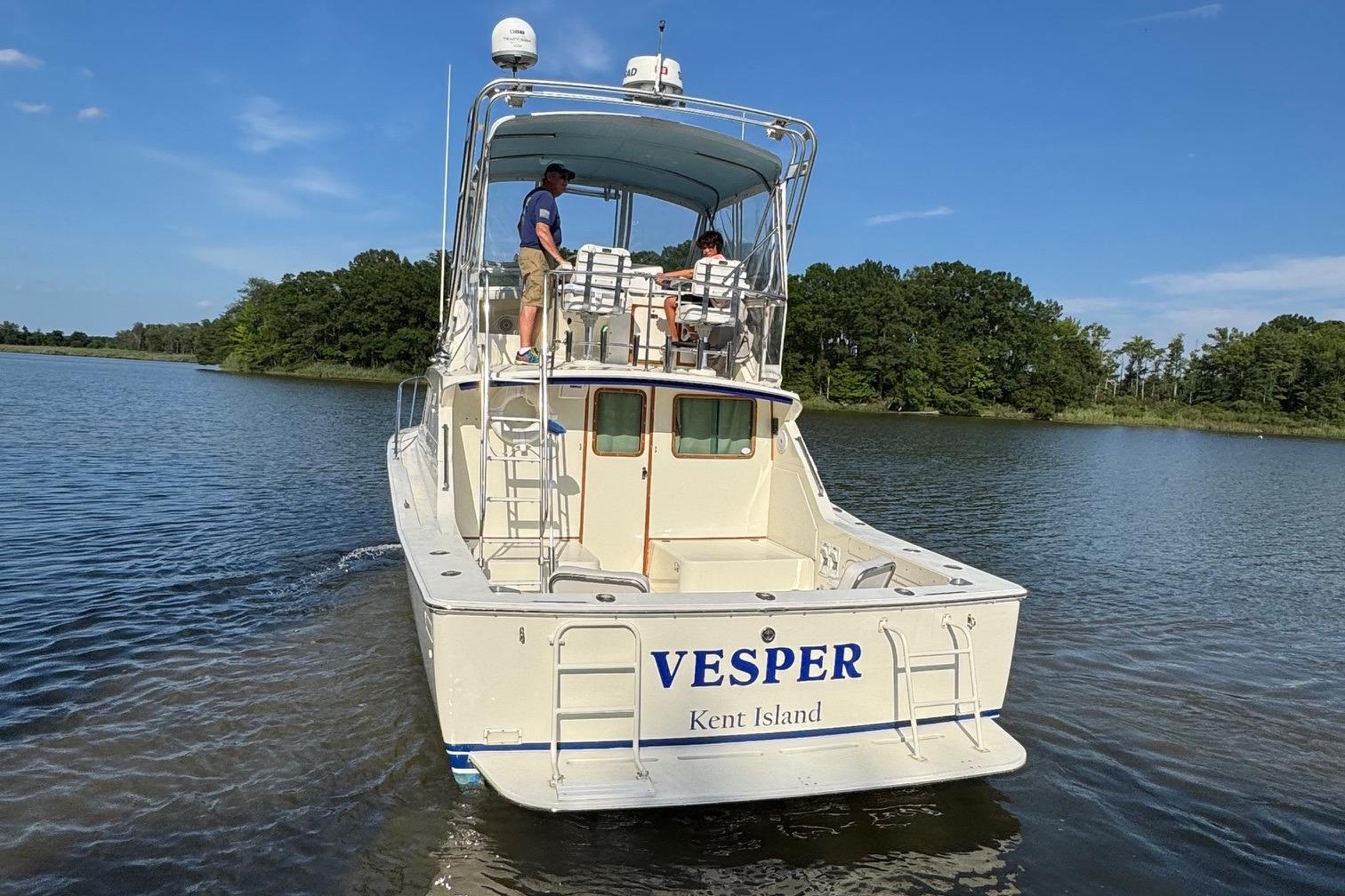 1987 Bertram 33 Sport Fisherman boat u0022VESPERu0022 on water near Kent Island.