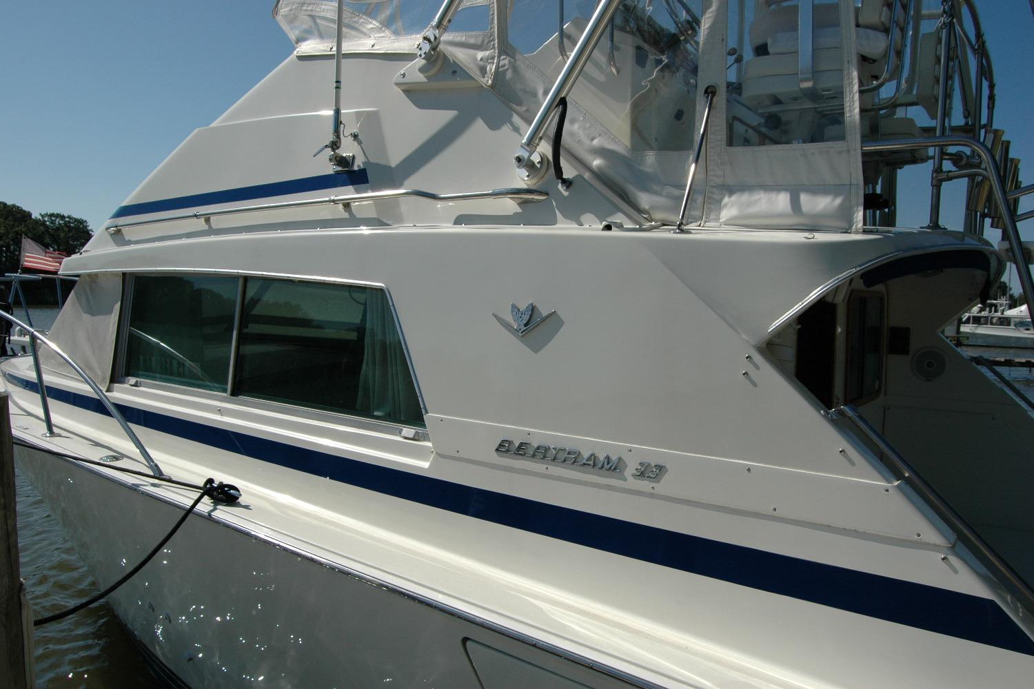 1987 Bertram 33 Sport Fisherman boat docked, showcasing sleek design and classic style.