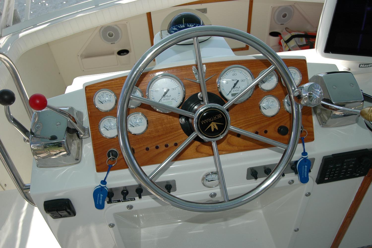 1987 Bertram 33 Sport Fisherman helm with gauges and steering wheel.