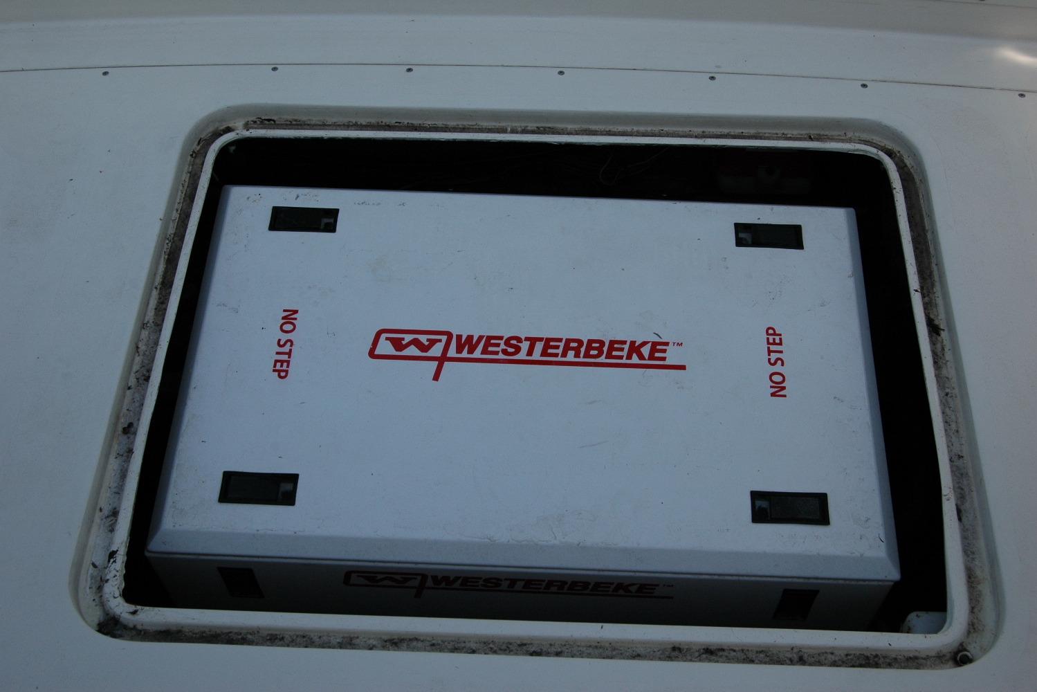 Westerbeke generator compartment on 1987 Bertram 33 Sport Fisherman boat.
