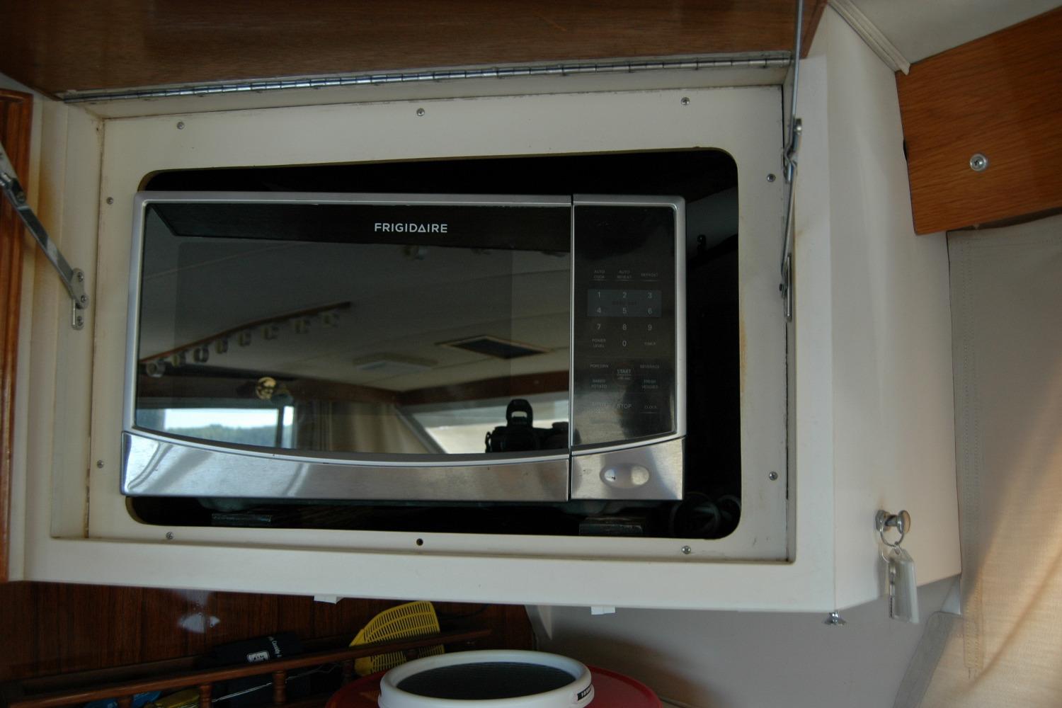 Frigidaire microwave installed in 1987 Bertram 33 Sport Fisherman boat interior.