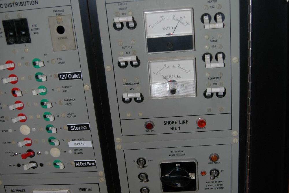 Electrical control panel on a 1987 Bertram 33 Sport Fisherman boat.