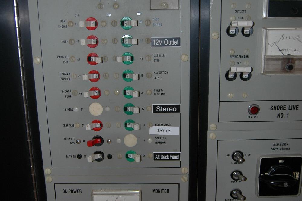 Electrical control panel on a 1987 Bertram 33 Sport Fisherman boat.